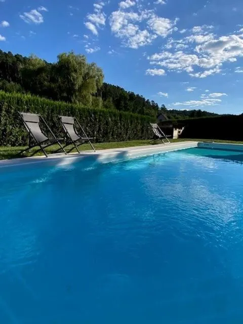 Swimming pool in Hôtel Restaurant La Couronne by K