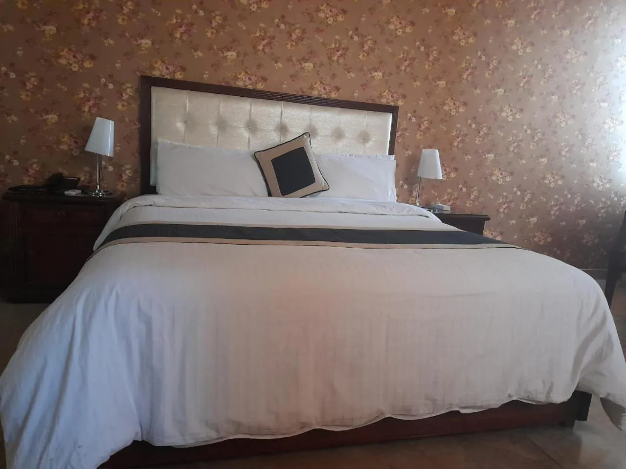 Bed in Shalimar Tower Hotel Lahore