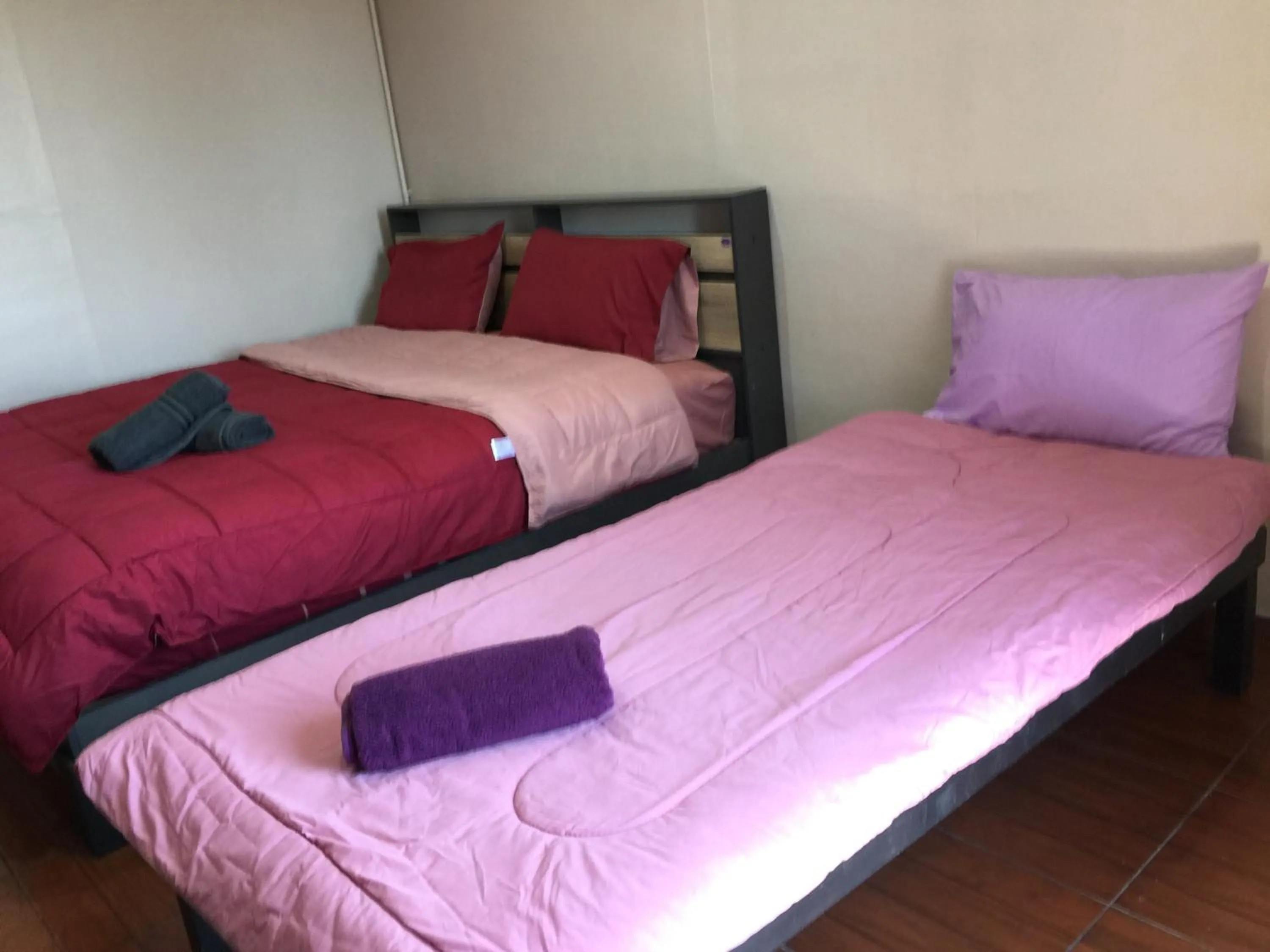 Bed in SMILE HOME GUESTHOUSE