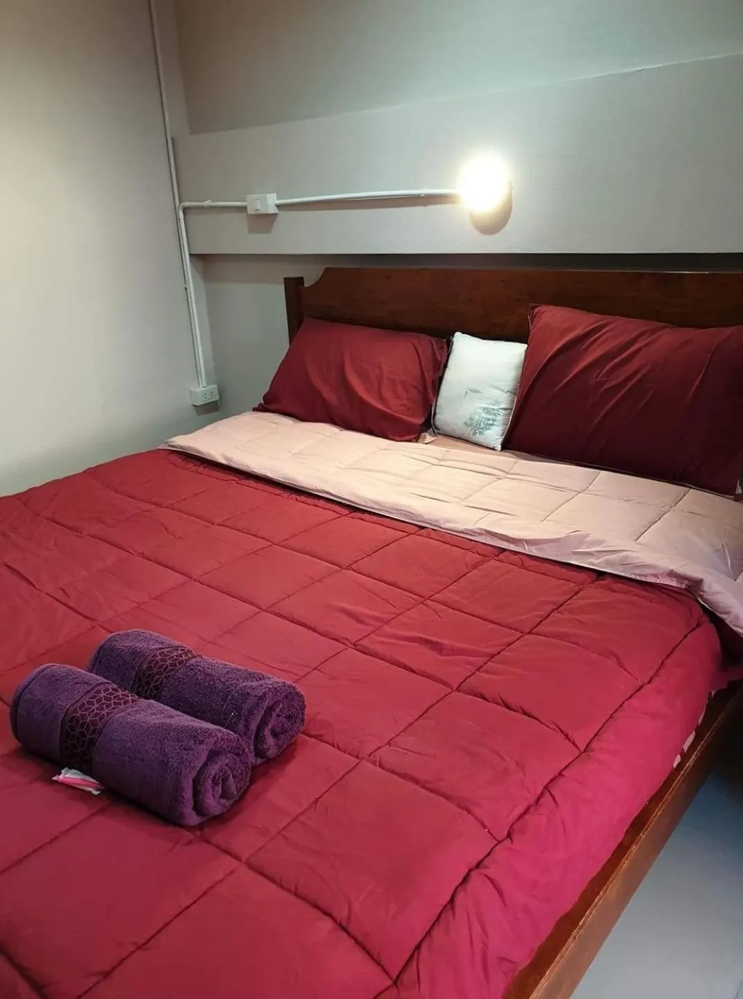 Bed in SMILE HOME GUESTHOUSE