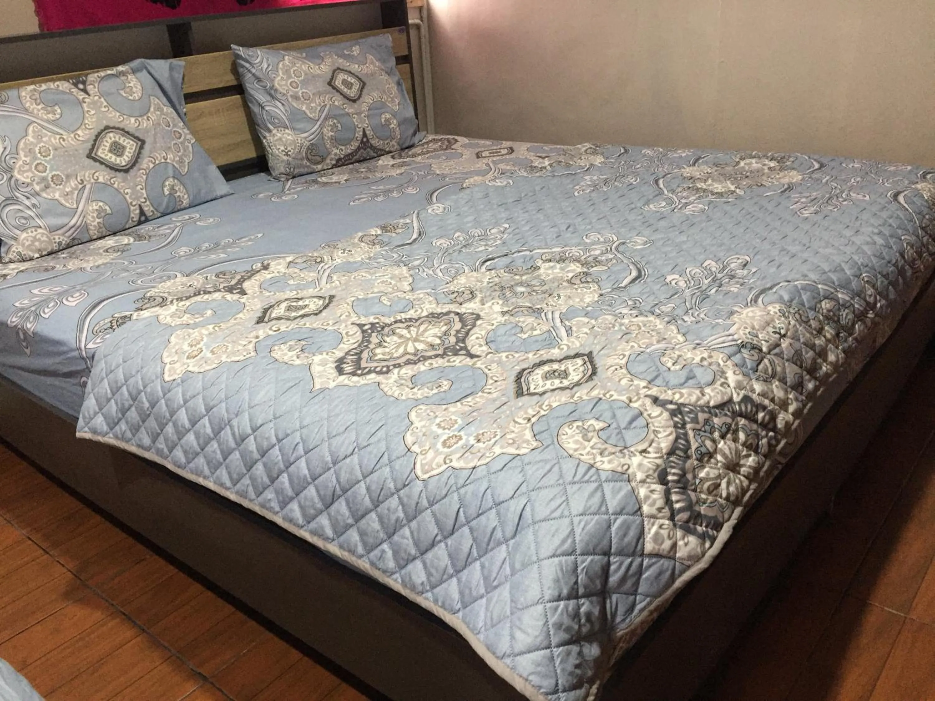 Bed in SMILE HOME GUESTHOUSE