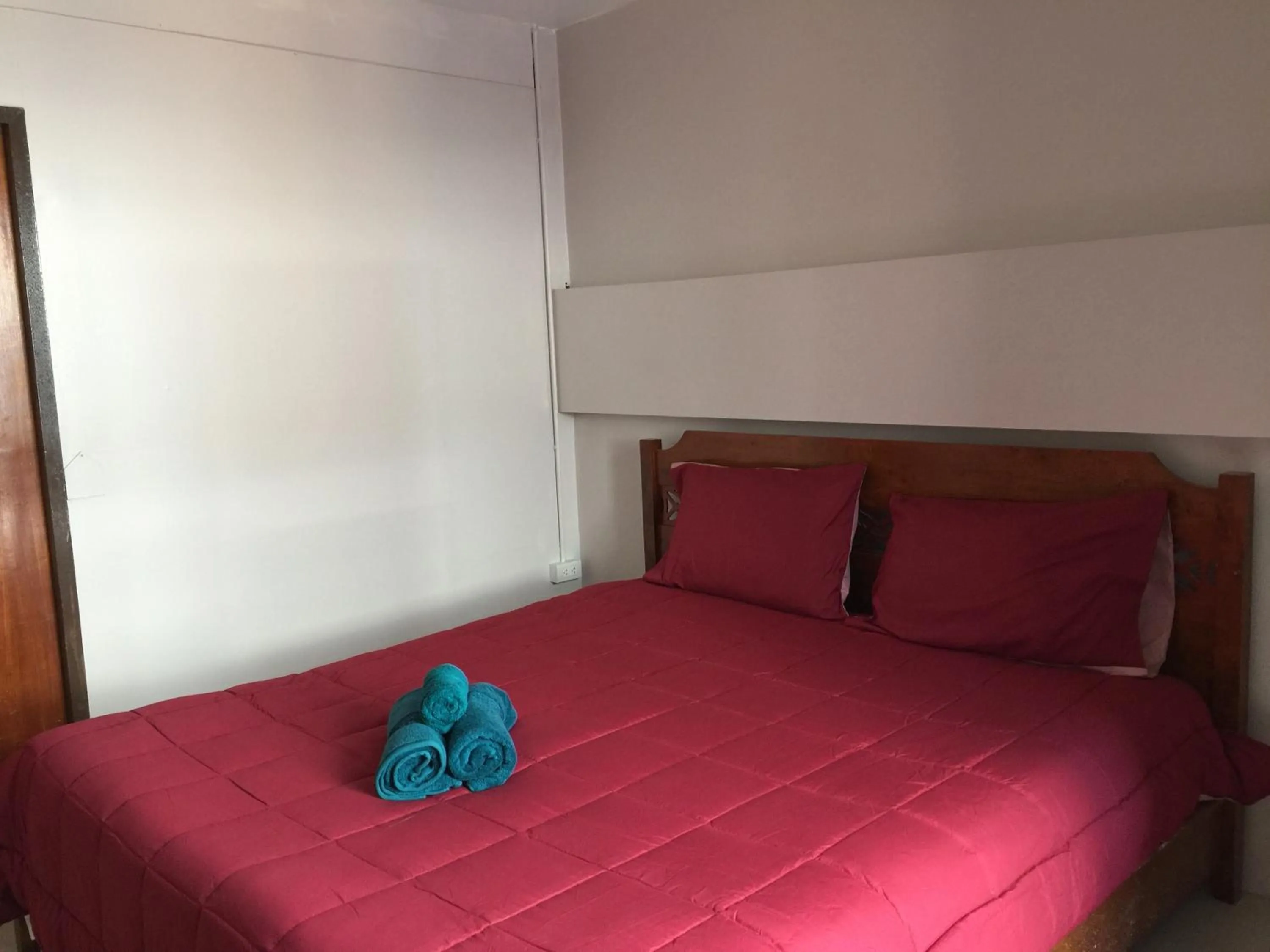 Bed in SMILE HOME GUESTHOUSE