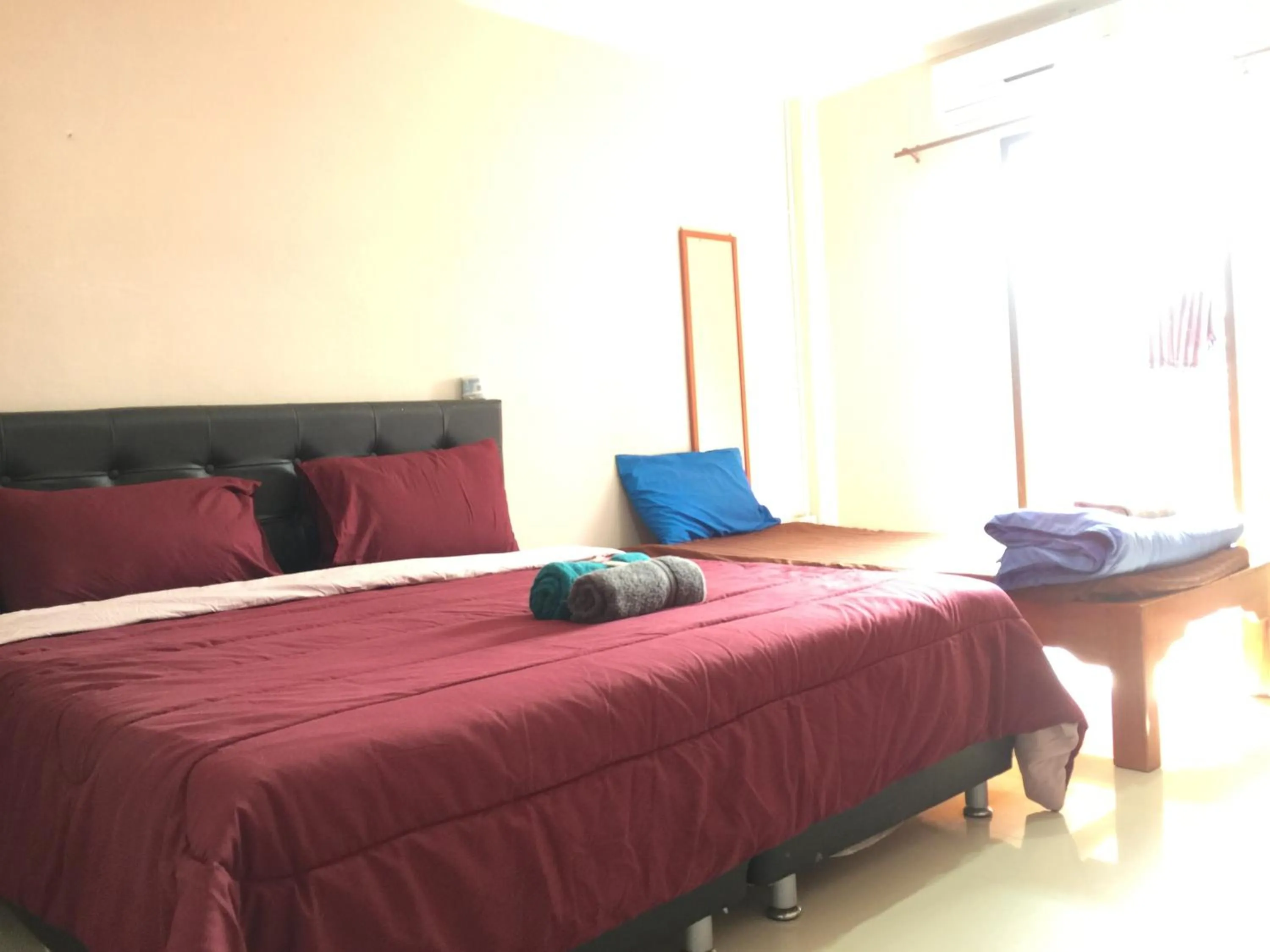 Bed in SMILE HOME GUESTHOUSE