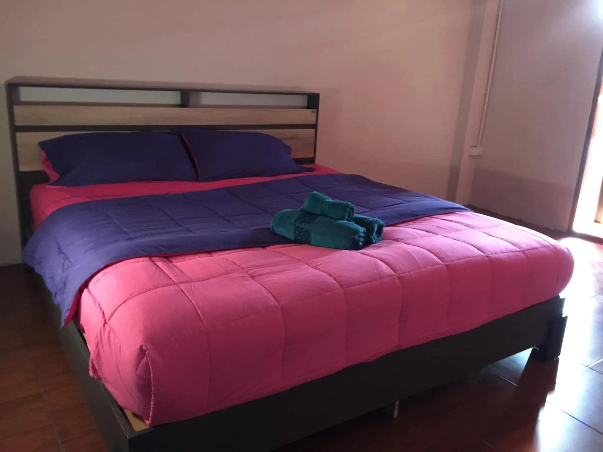 Bed in SMILE HOME GUESTHOUSE