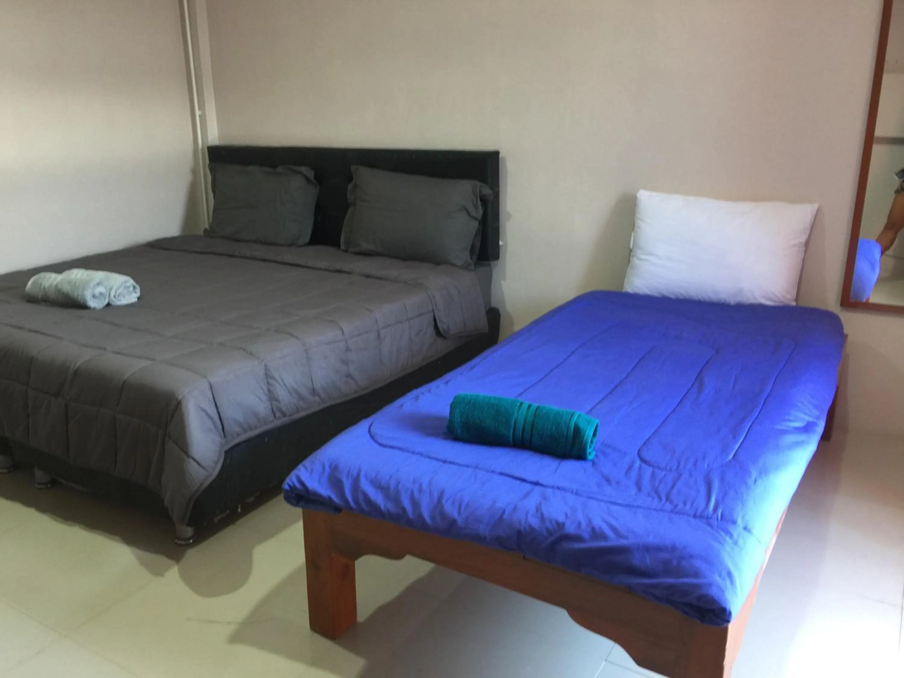 Bed in SMILE HOME GUESTHOUSE