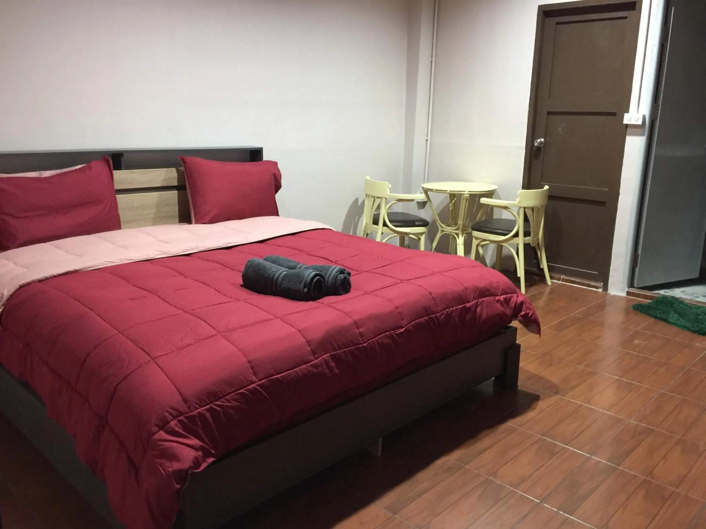 Bed in SMILE HOME GUESTHOUSE