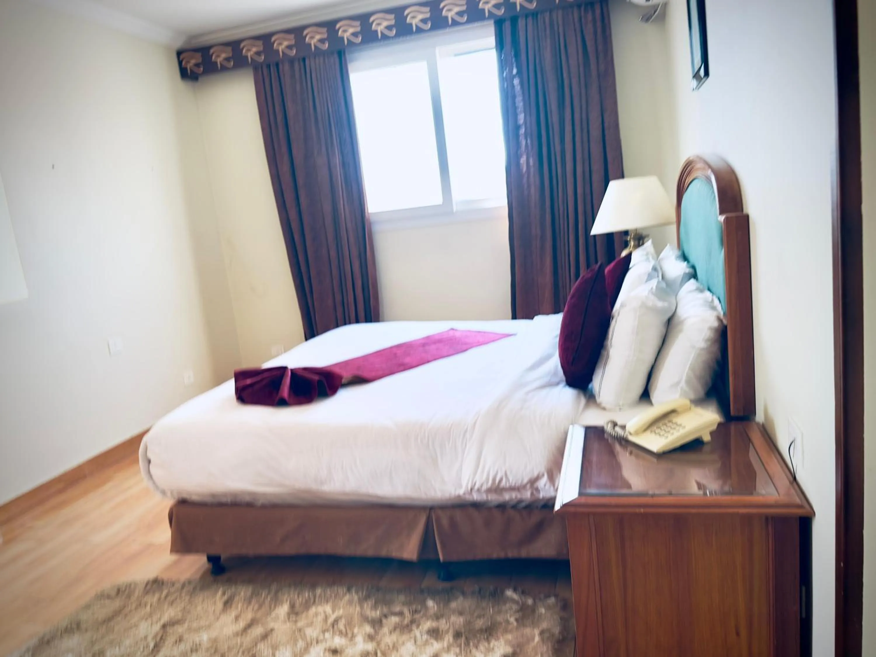 Bed in PYRAMIDS TOWER Inn