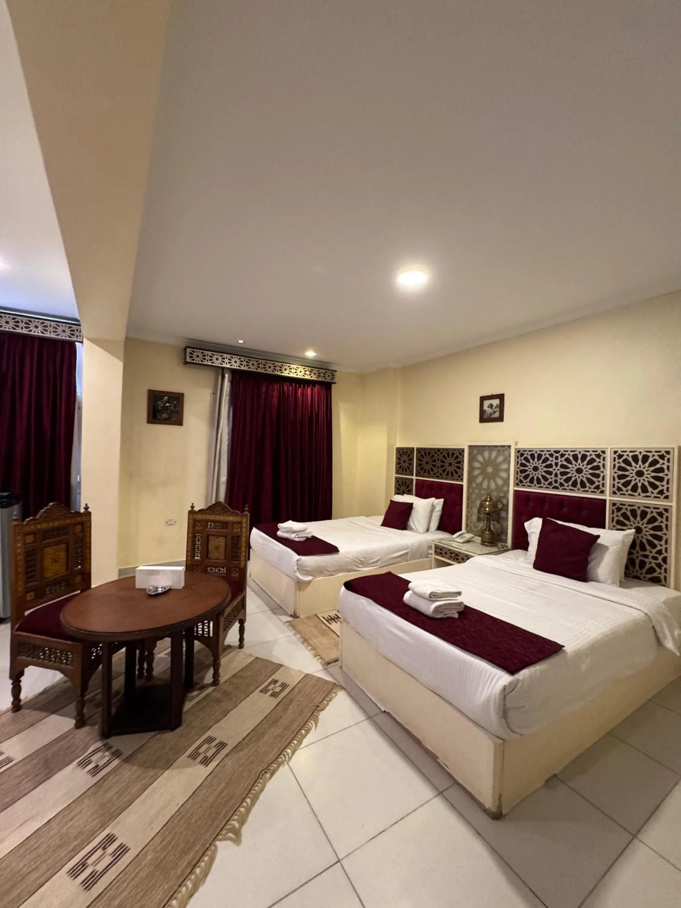 Bed in PYRAMIDS TOWER Inn