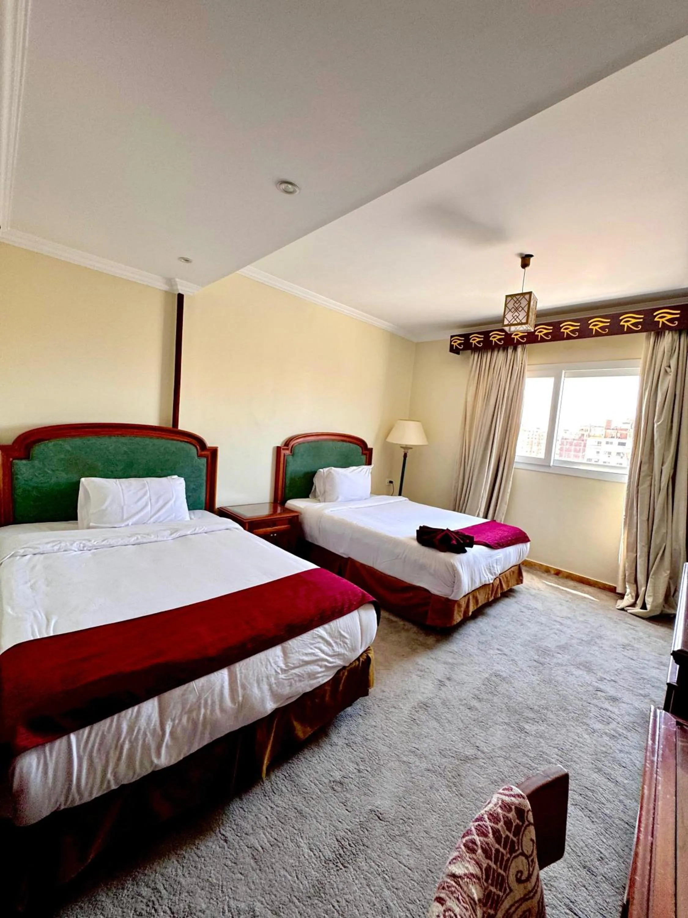 Bed in PYRAMIDS TOWER Inn