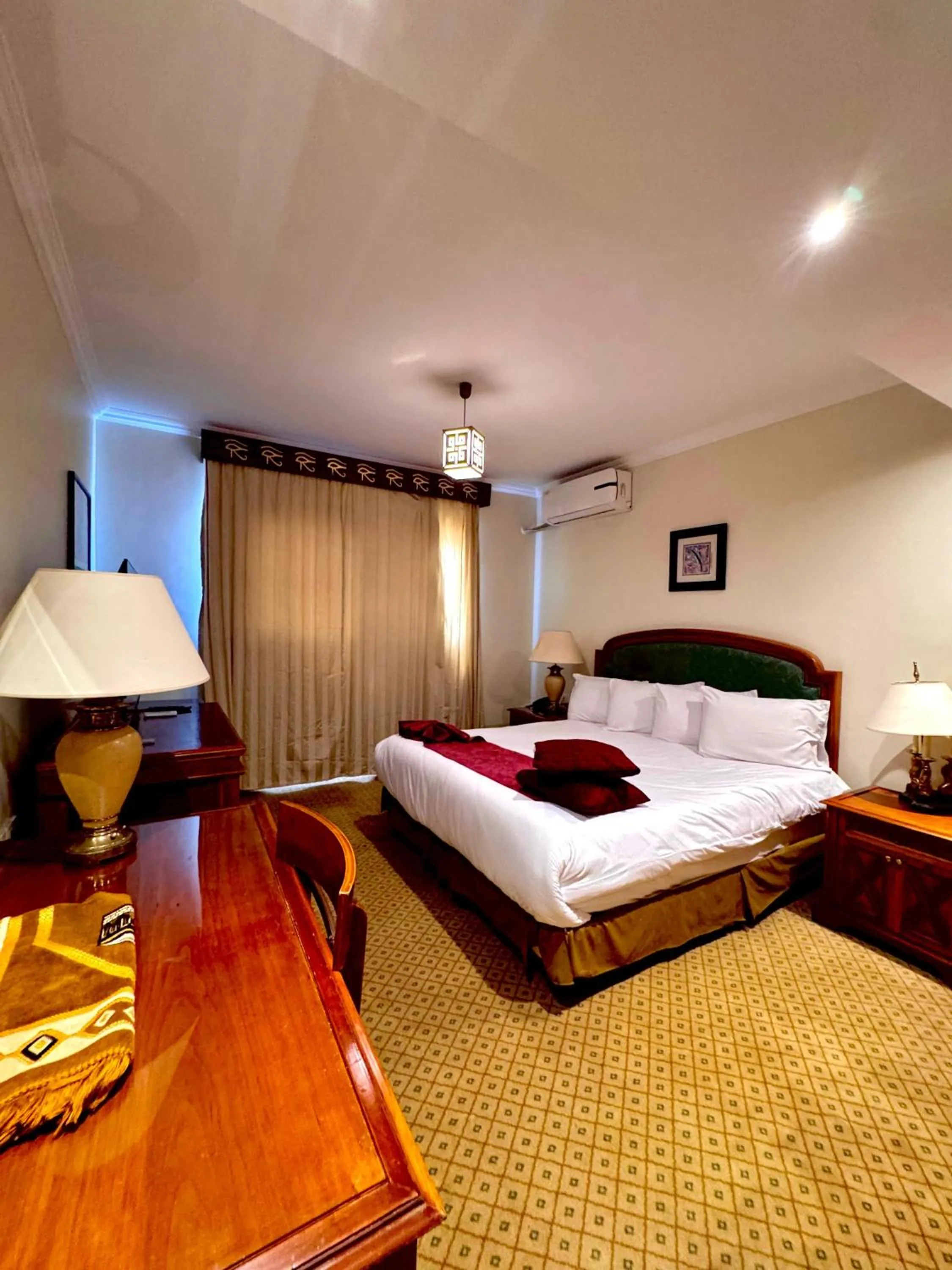 Bed in PYRAMIDS TOWER Inn