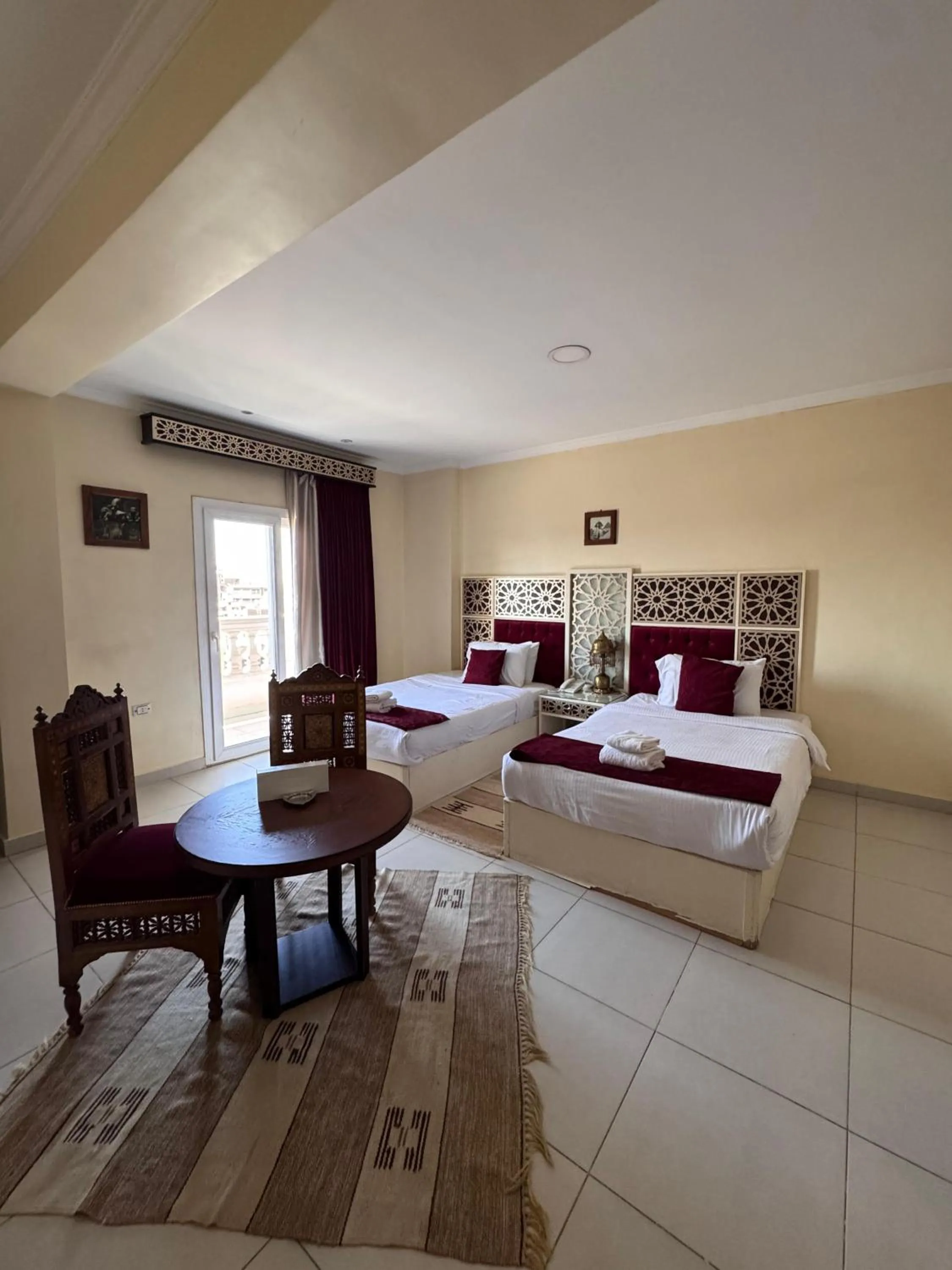 Bed in PYRAMIDS TOWER Inn