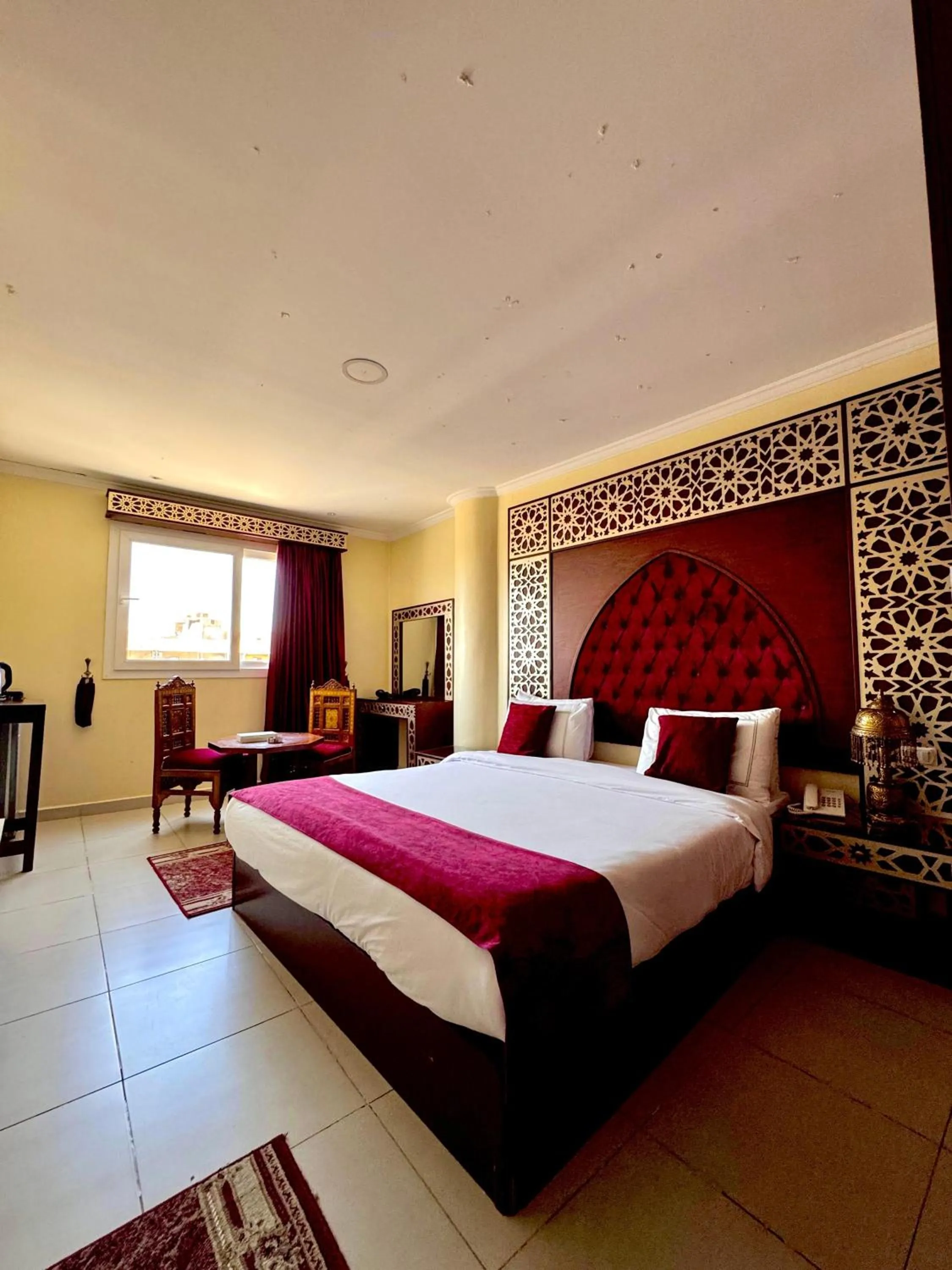 Bed in PYRAMIDS TOWER Inn