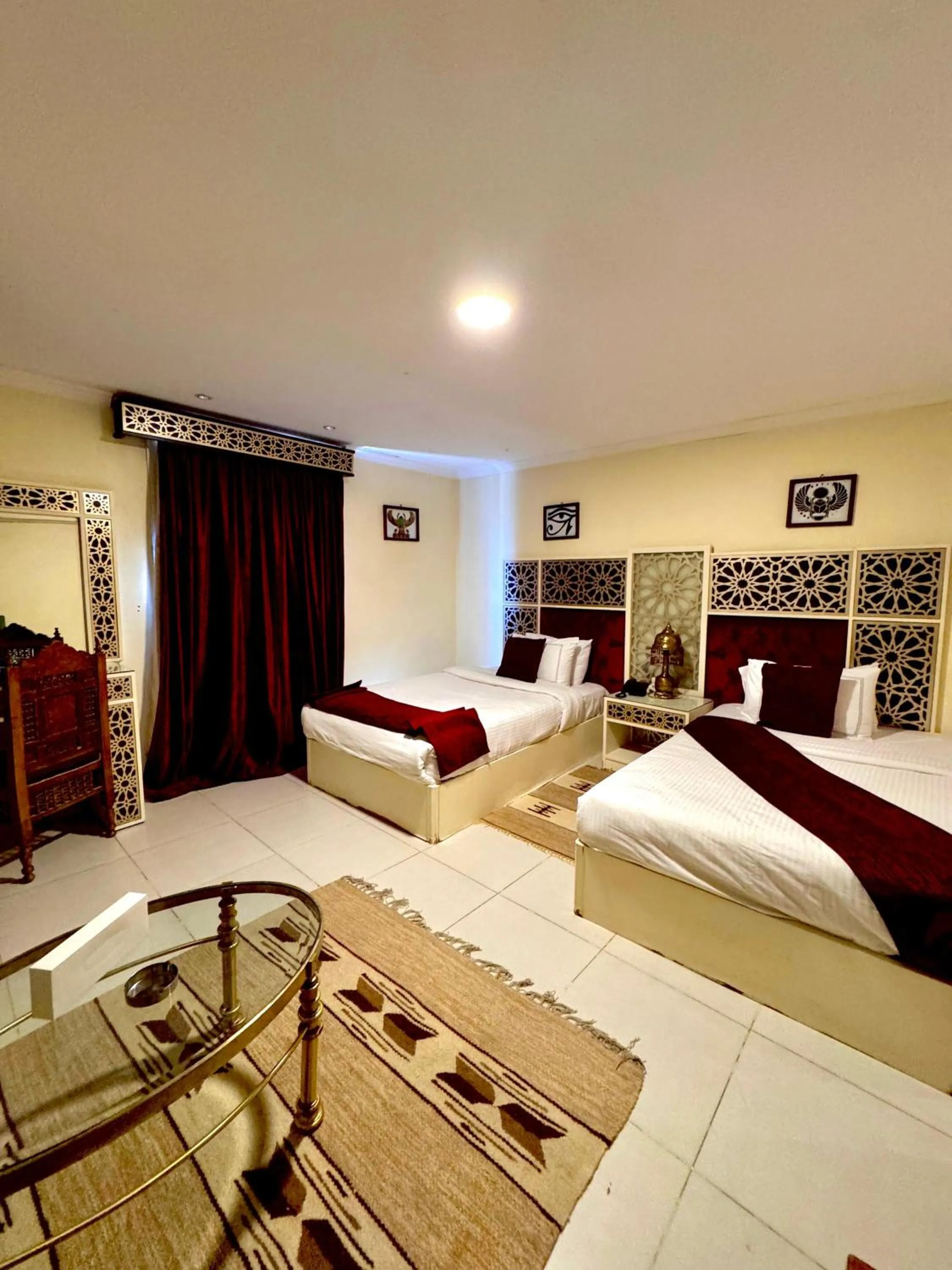 Bed in PYRAMIDS TOWER Inn