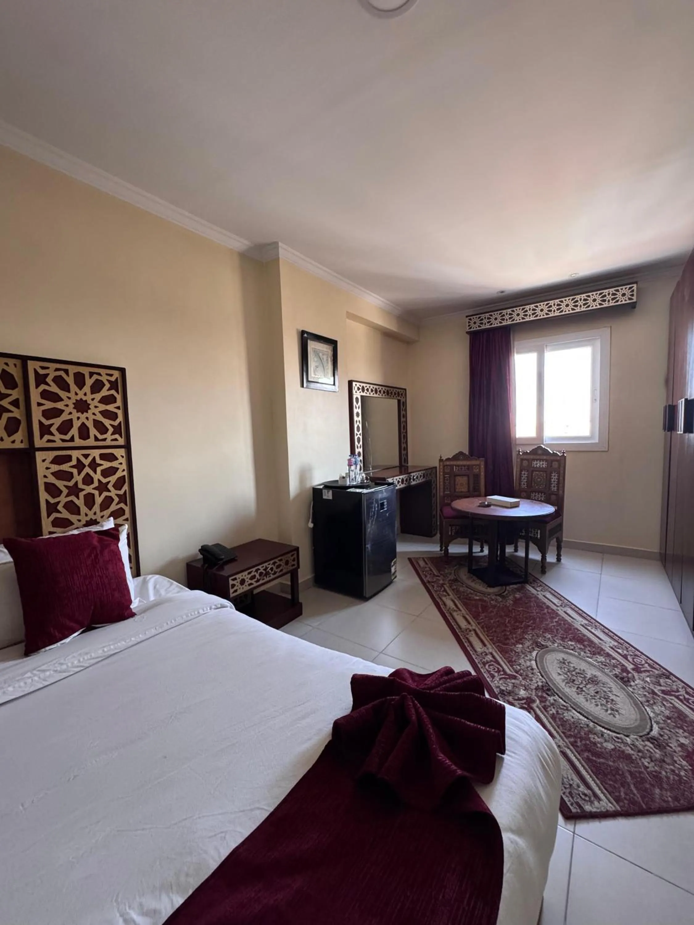 Communal lounge/ TV room, Bed in PYRAMIDS TOWER Inn