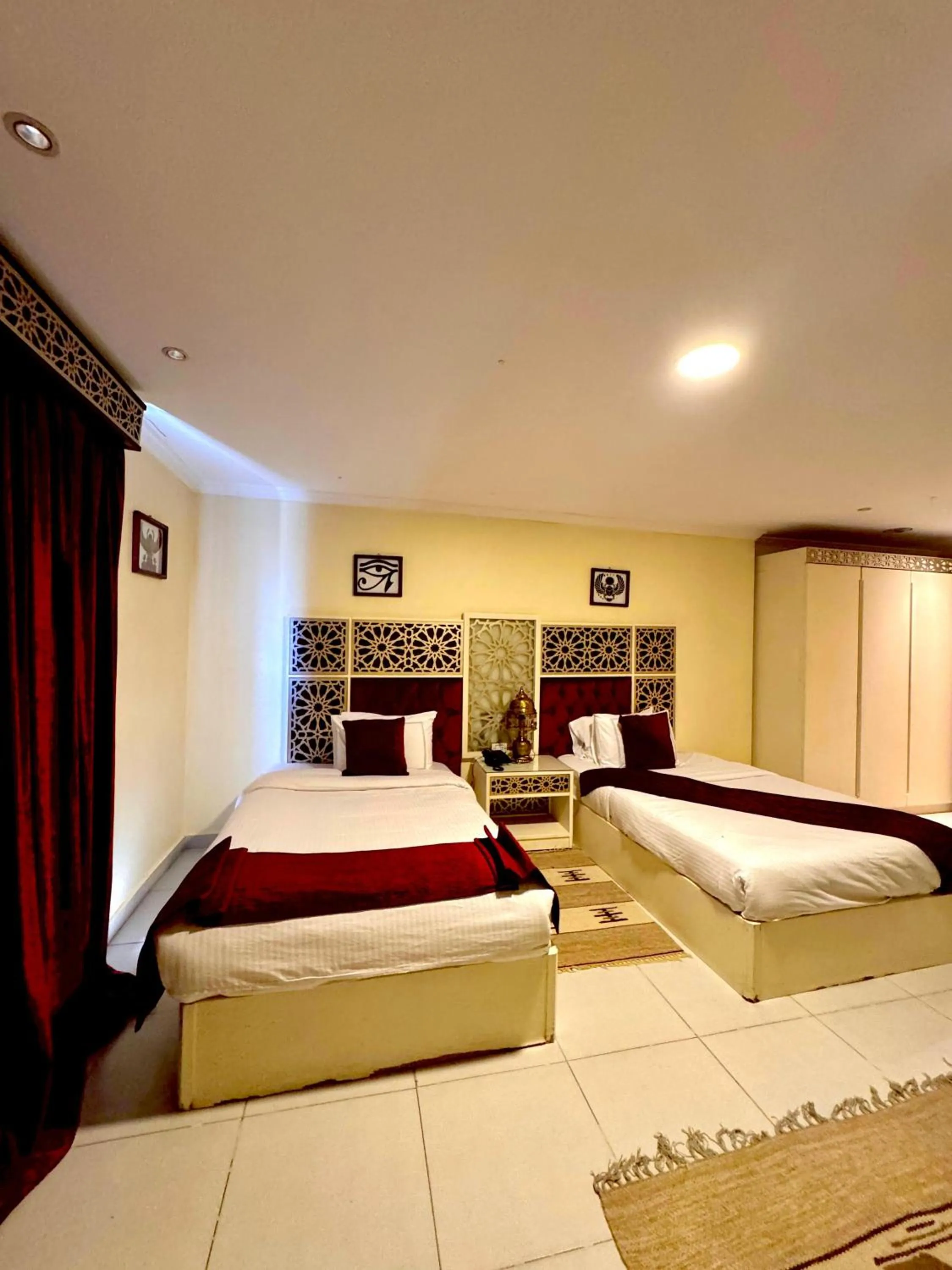 Bed in PYRAMIDS TOWER Inn