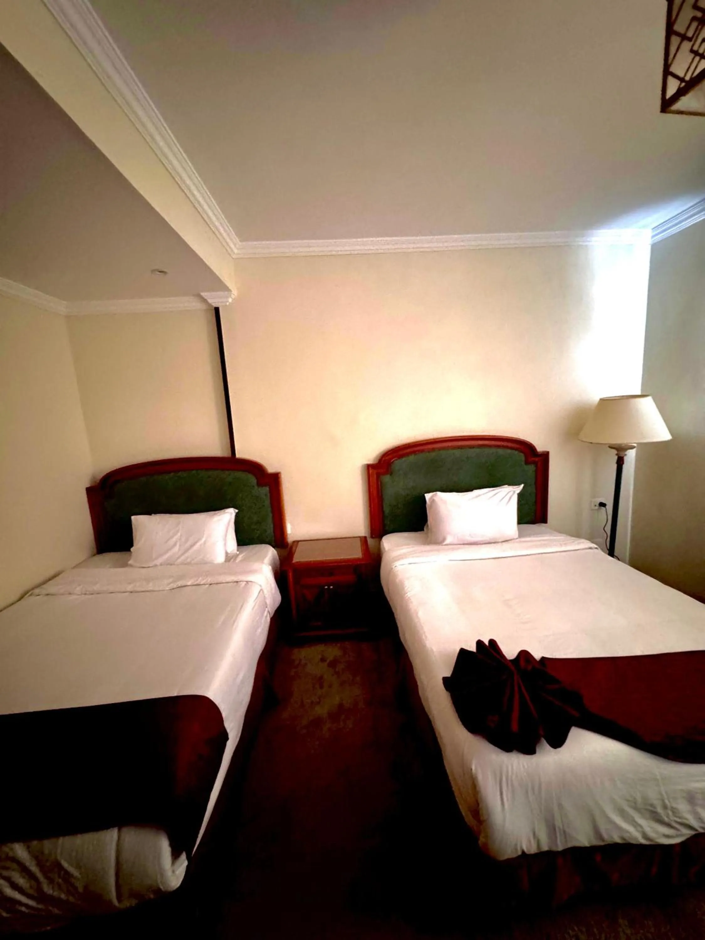 Bed in PYRAMIDS TOWER Inn