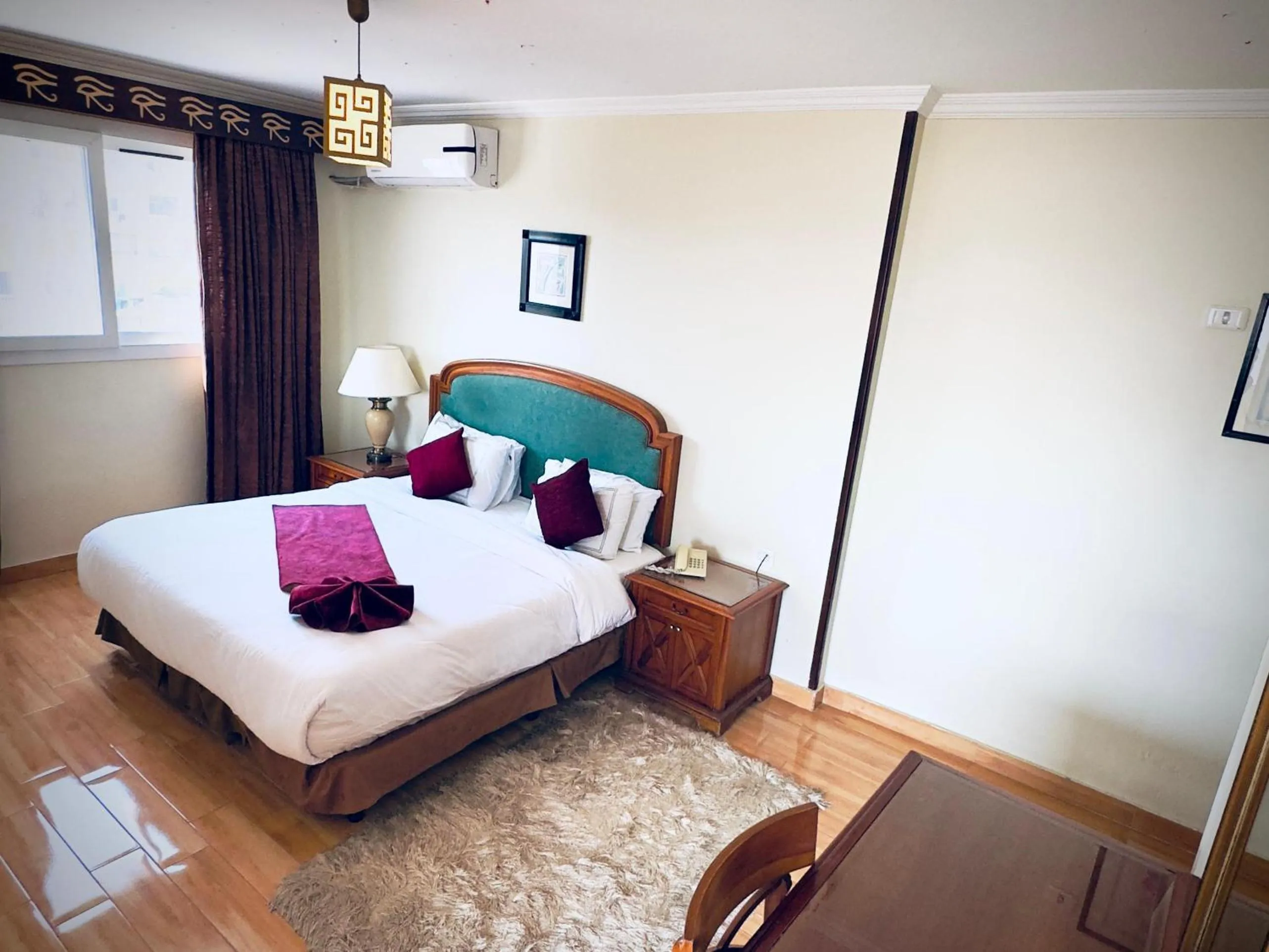 Bed in PYRAMIDS TOWER Inn