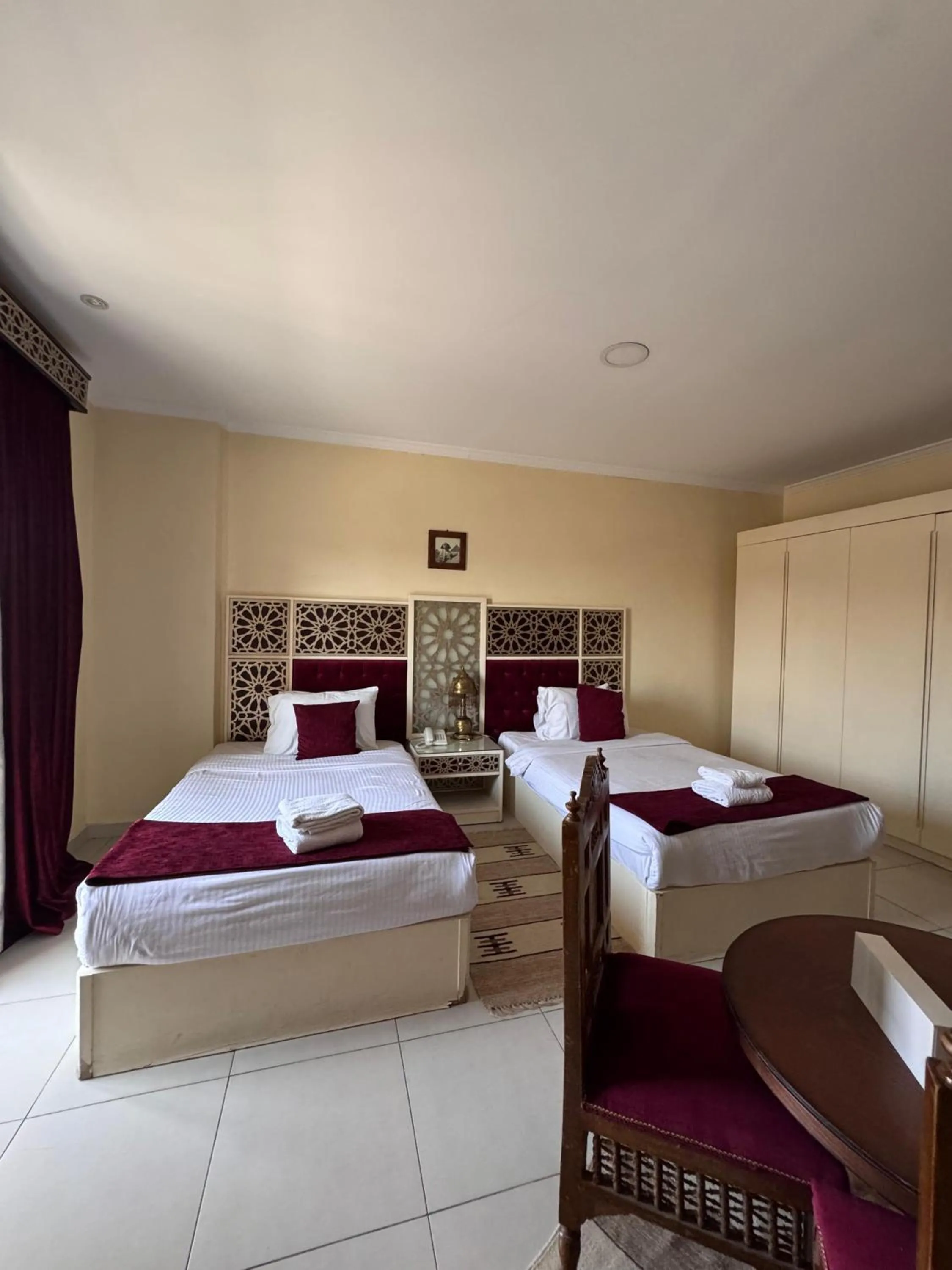 Bed in PYRAMIDS TOWER Inn