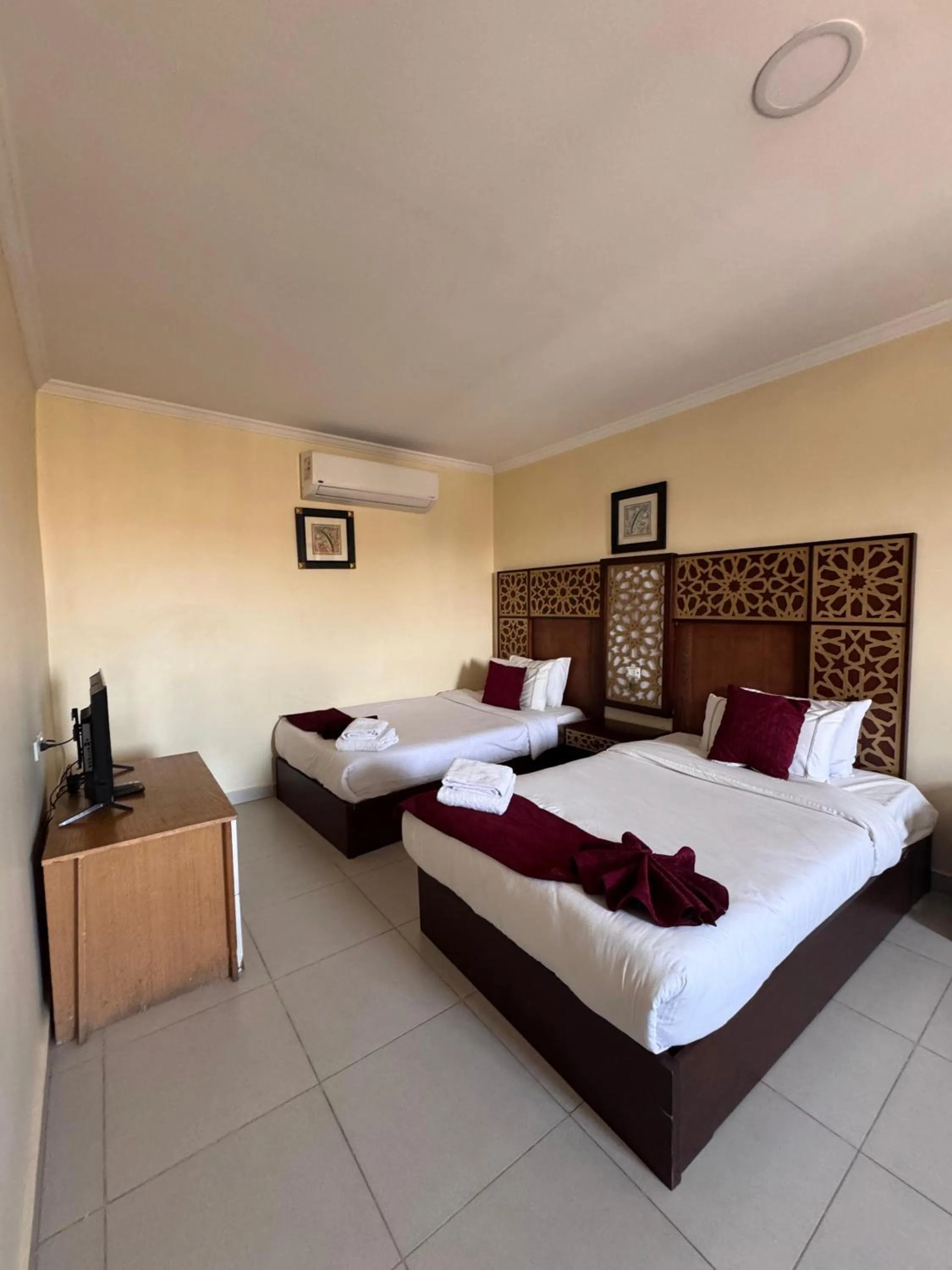 Bed in PYRAMIDS TOWER Inn