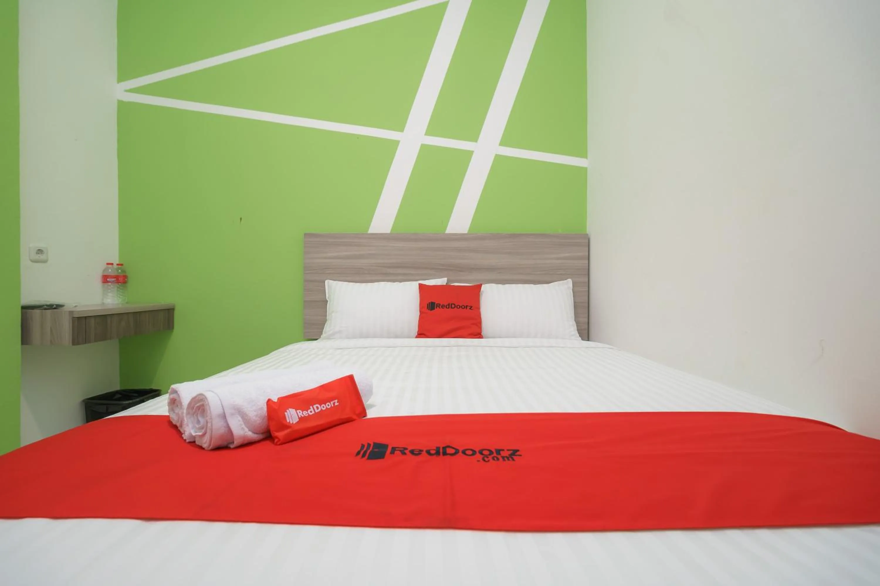 Bedroom, Bed in RedDoorz Plus at Grand Tara Homestay Palembang