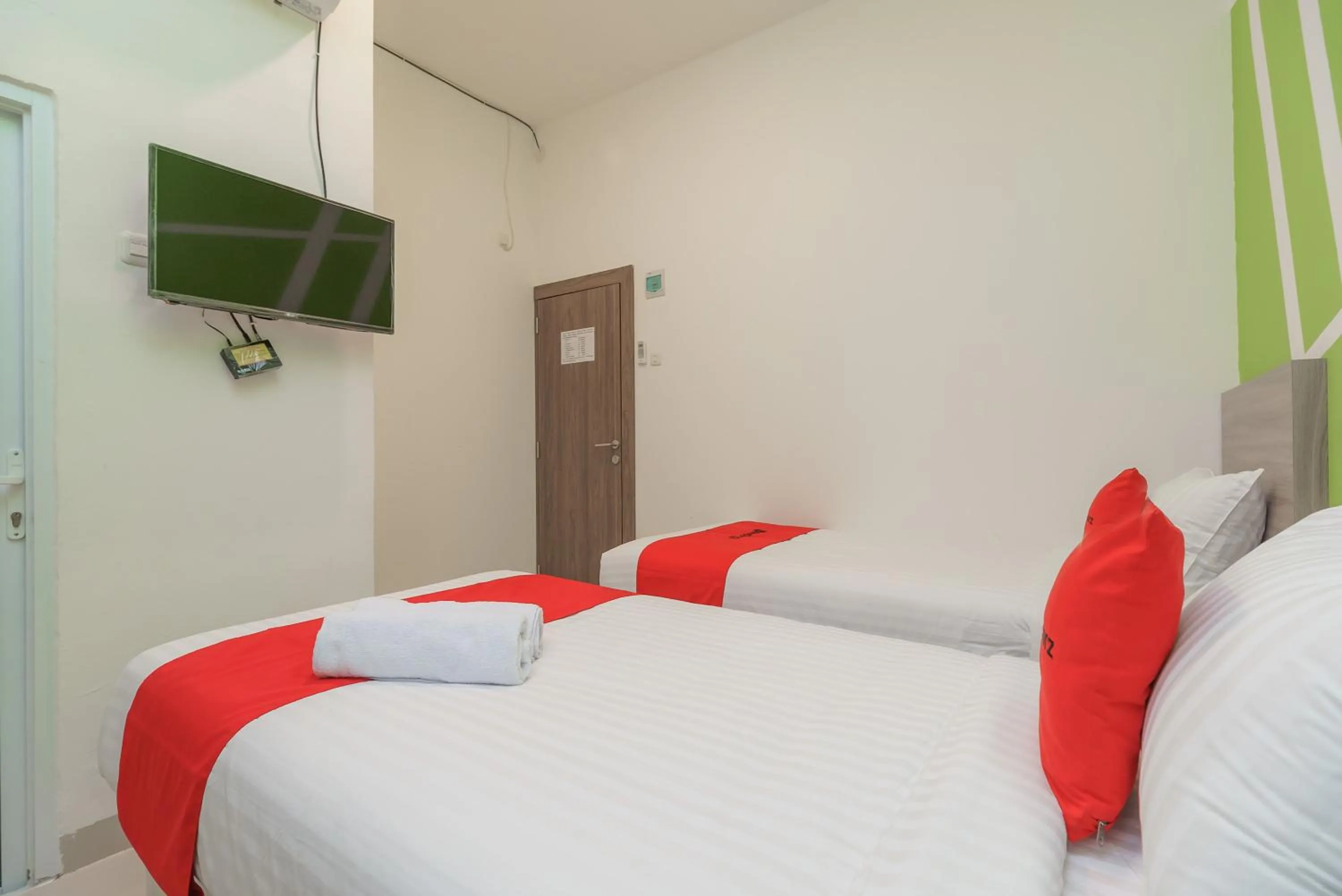 Bedroom, Bed in RedDoorz Plus at Grand Tara Homestay Palembang