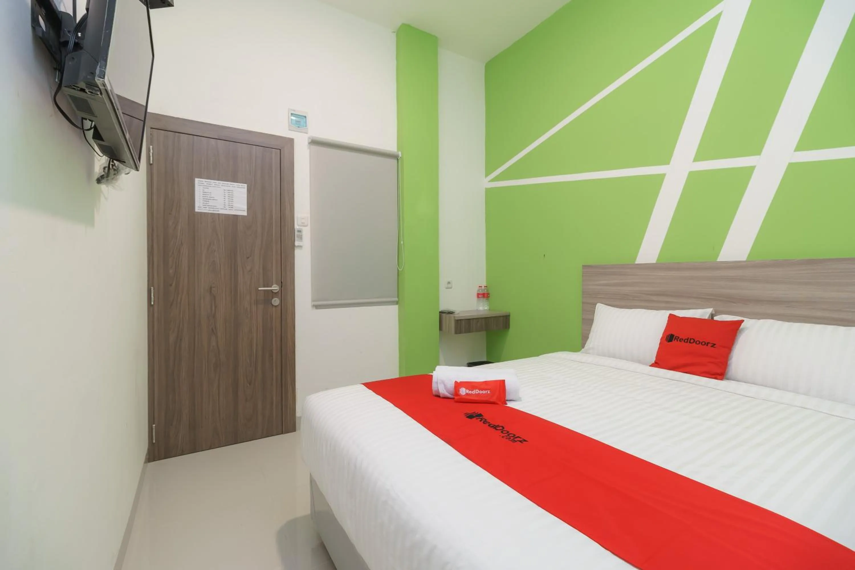 Bedroom, Bed in RedDoorz Plus at Grand Tara Homestay Palembang