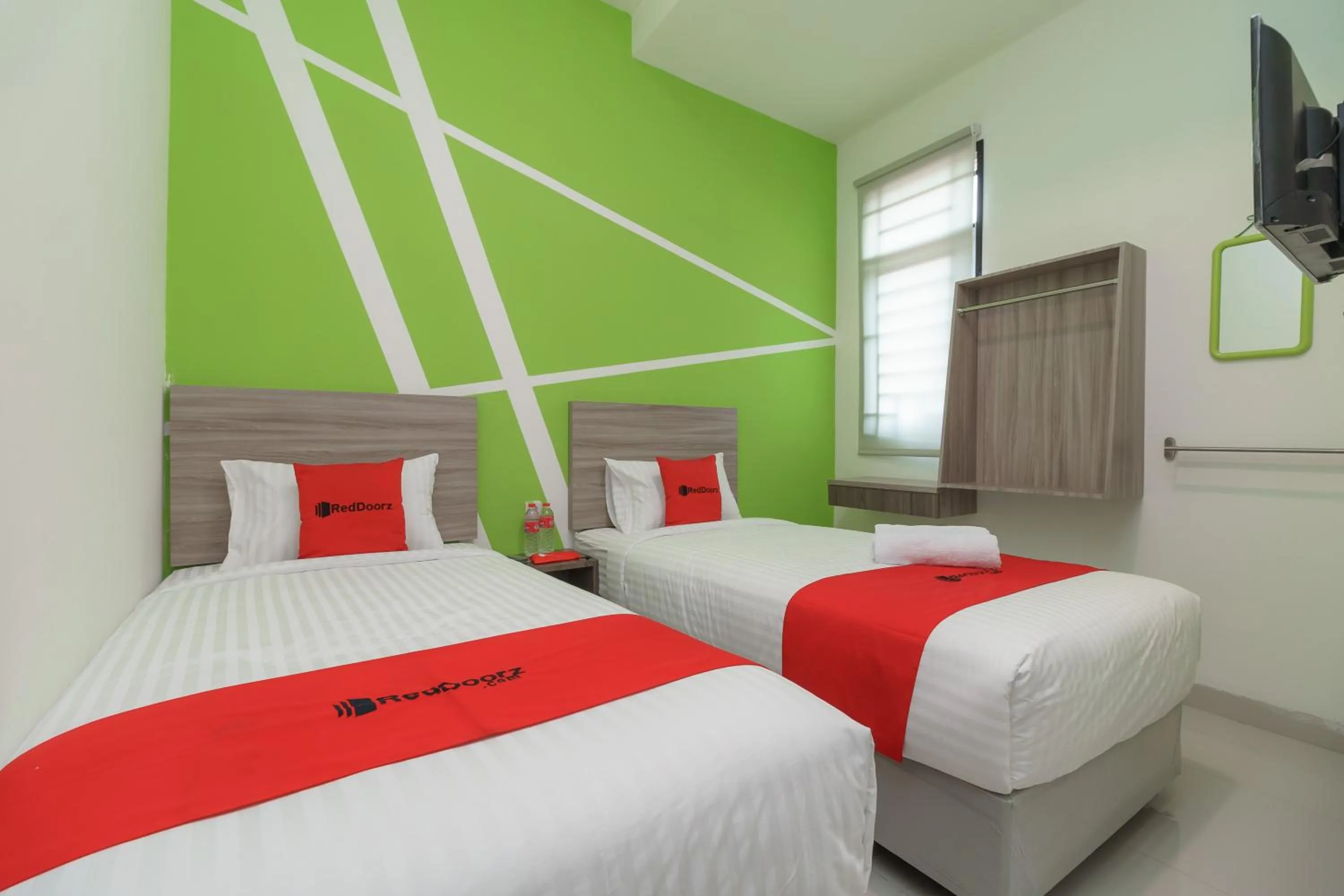 Bedroom, Bed in RedDoorz Plus at Grand Tara Homestay Palembang