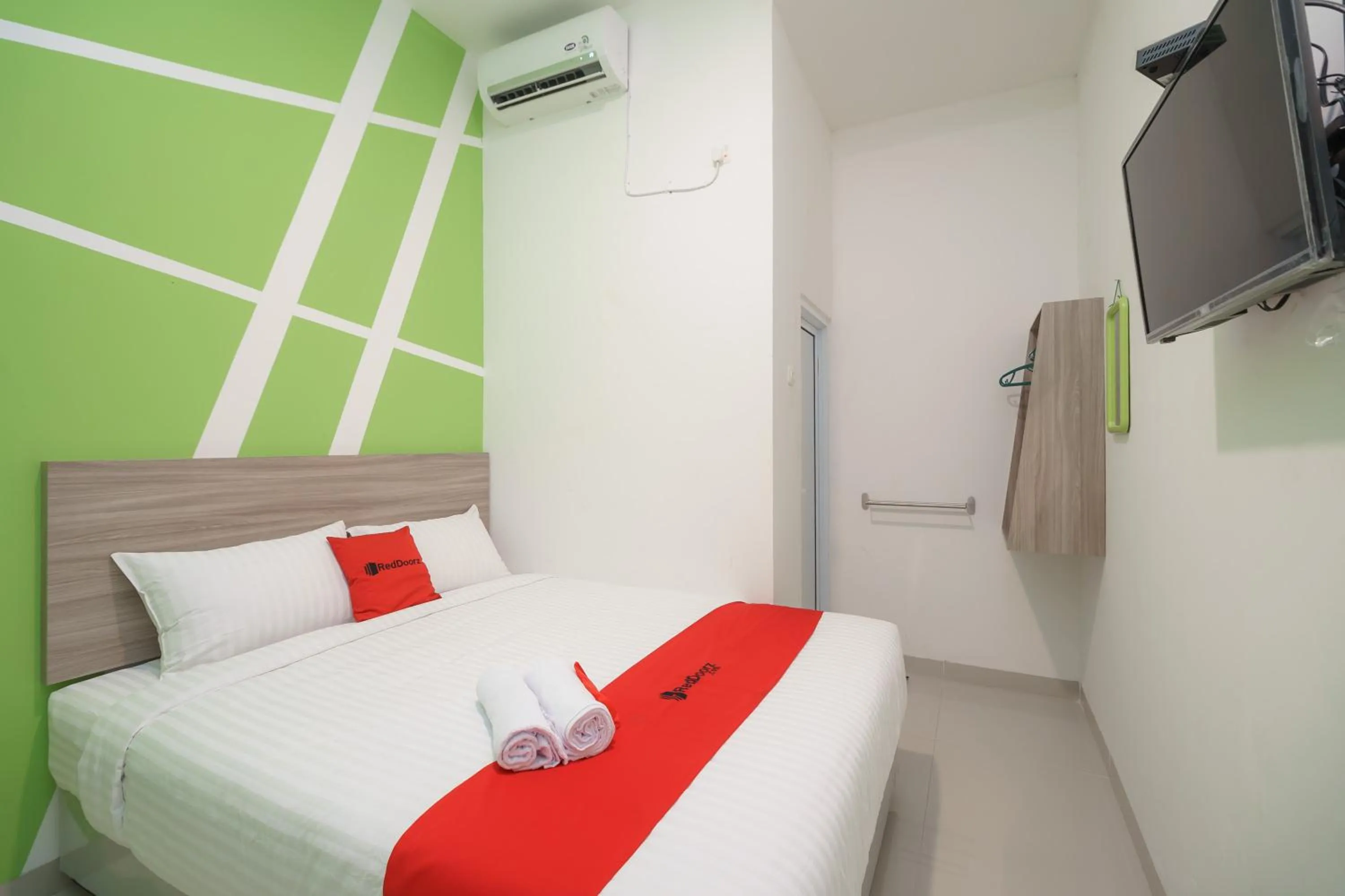 Bedroom, Bed in RedDoorz Plus at Grand Tara Homestay Palembang