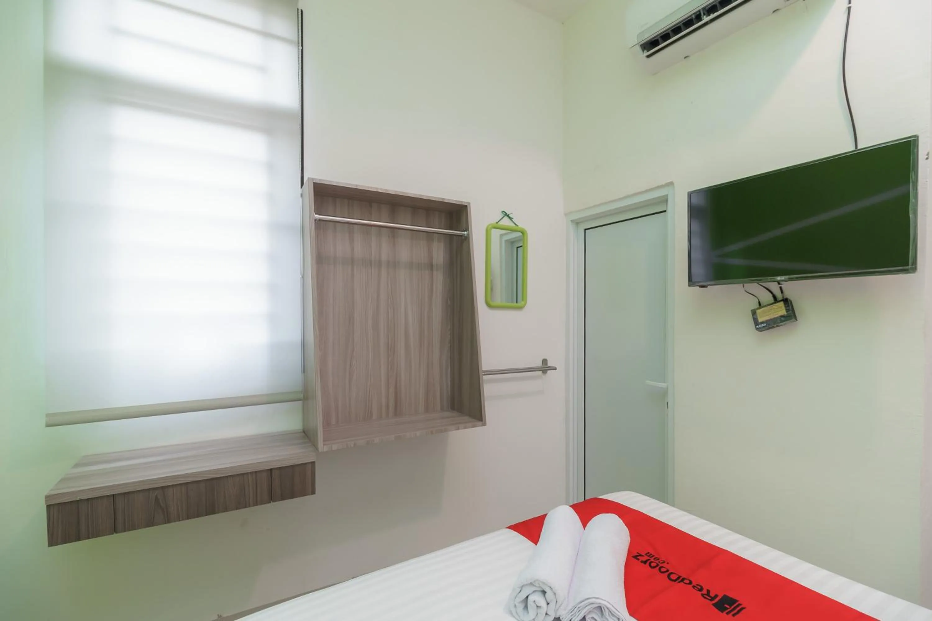Bedroom, Bed in RedDoorz Plus at Grand Tara Homestay Palembang