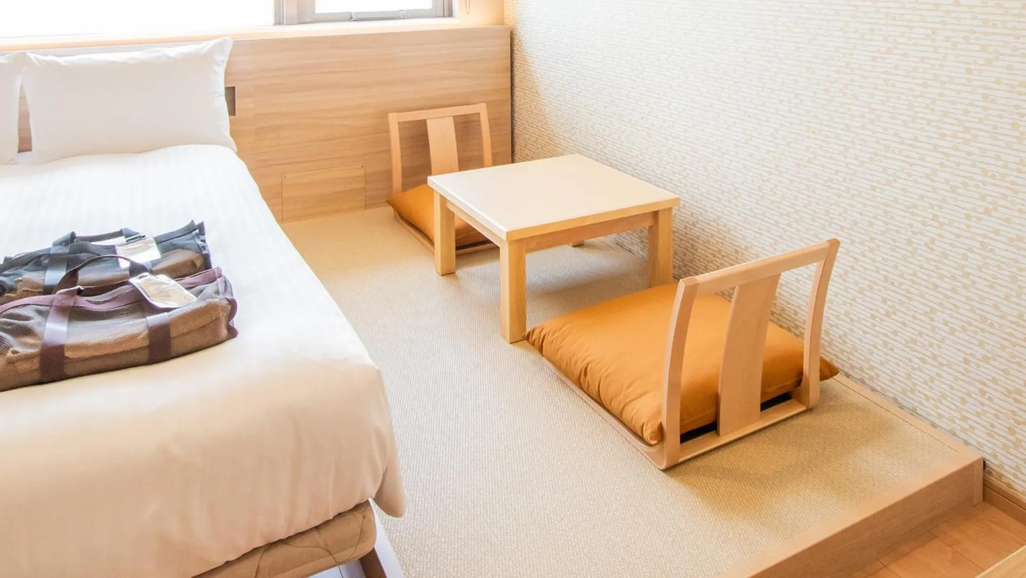 Bed in HOTEL SANSUI NAHA Ryukyu Onsen Naminoue-No-Yu