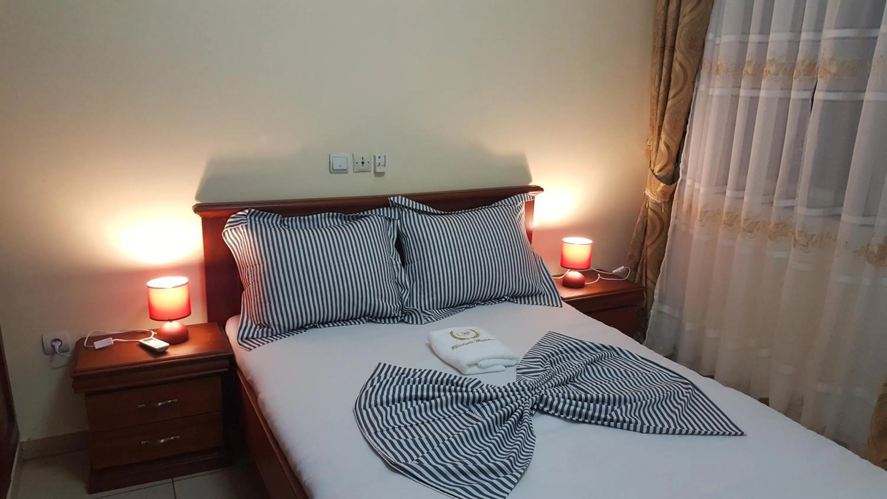 Bed in Résidences hôtelières Micheline et Emile BASTOS