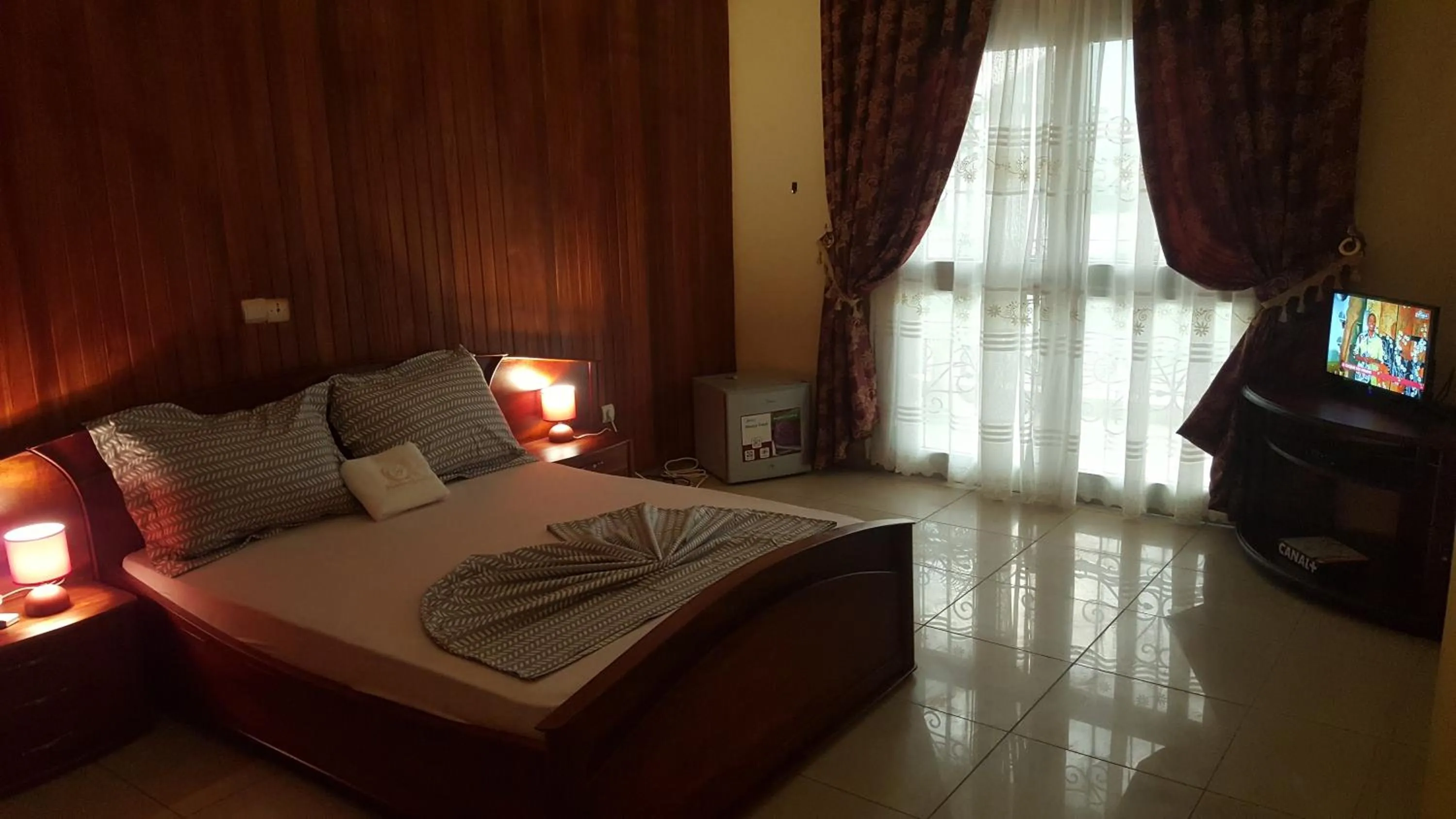 Bed in Résidences hôtelières Micheline et Emile BASTOS