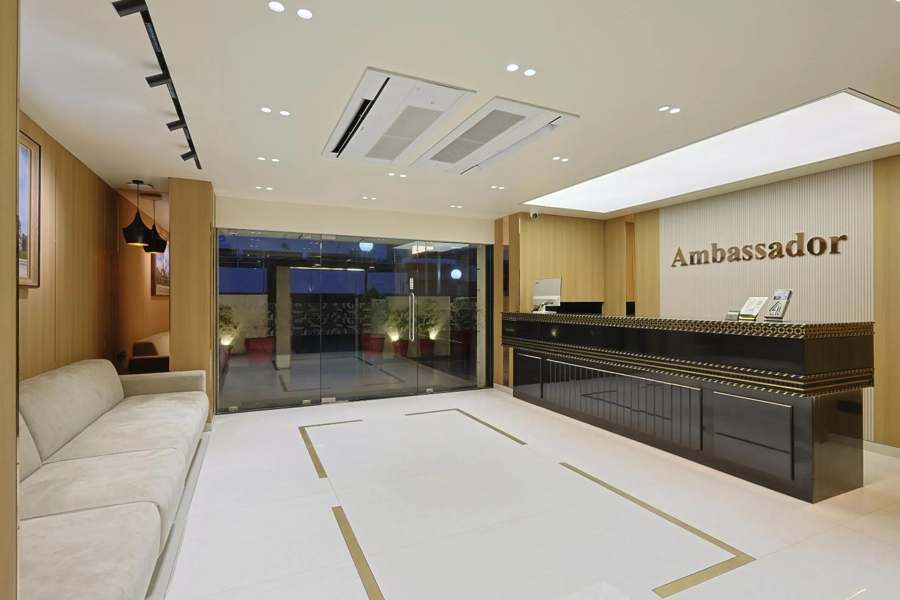 Property logo or sign in The Ambassador