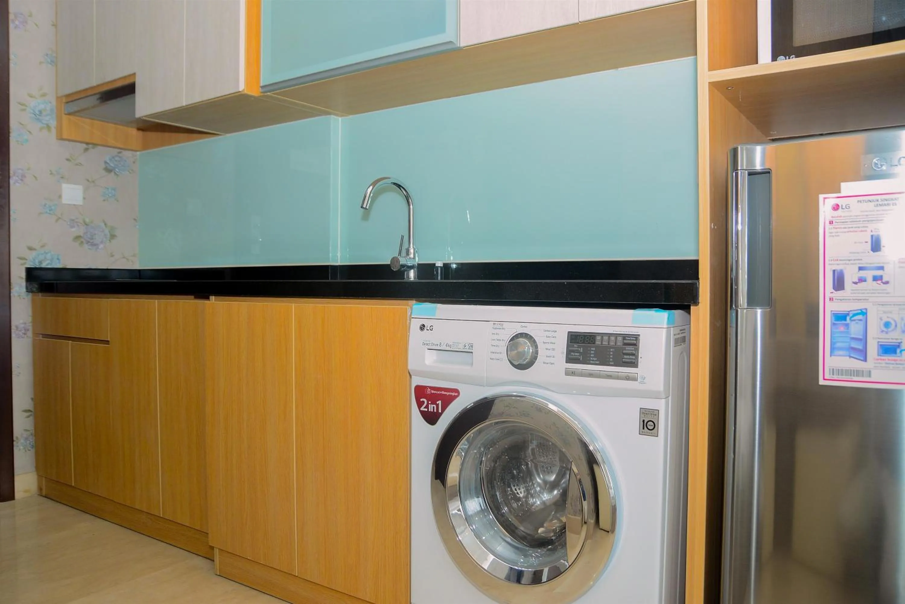 Kitchen or kitchenette in Tranquil Studio Apartment at Menteng Park By Travelio