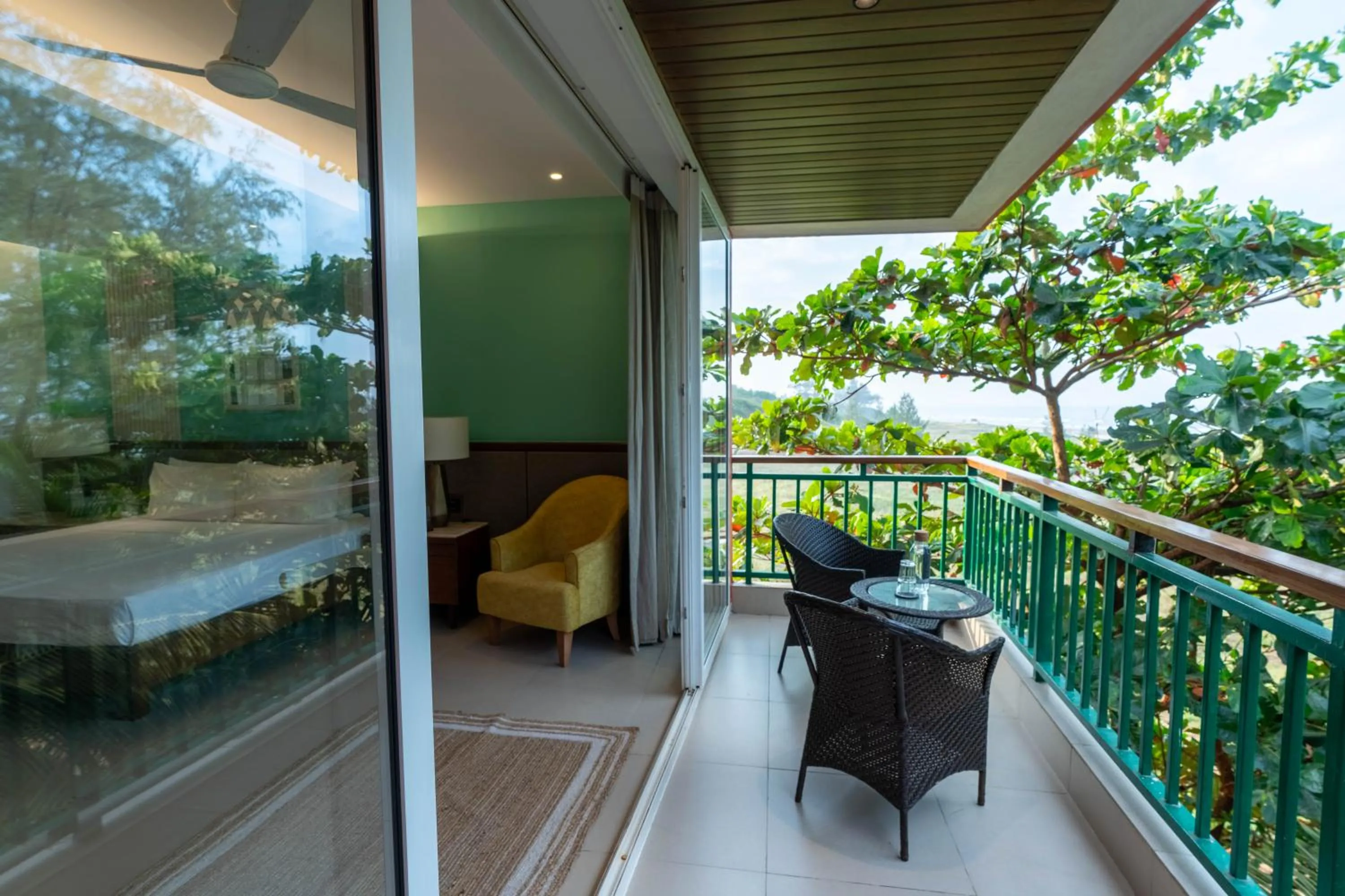 Bed in Mandrem Beach Resort, a member of Radisson Individuals Retreat