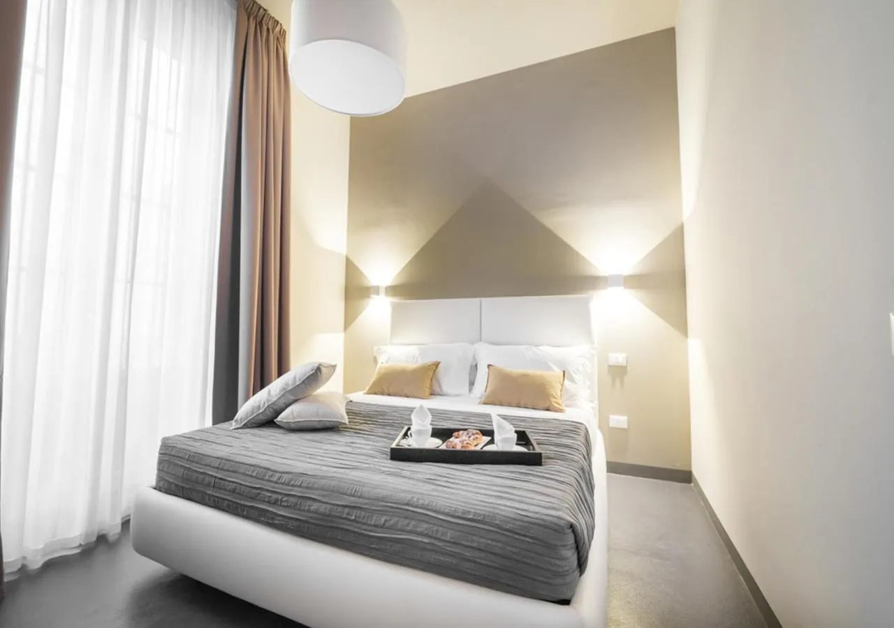 Bed in LUCUS Exclusive Bed and Breakfast