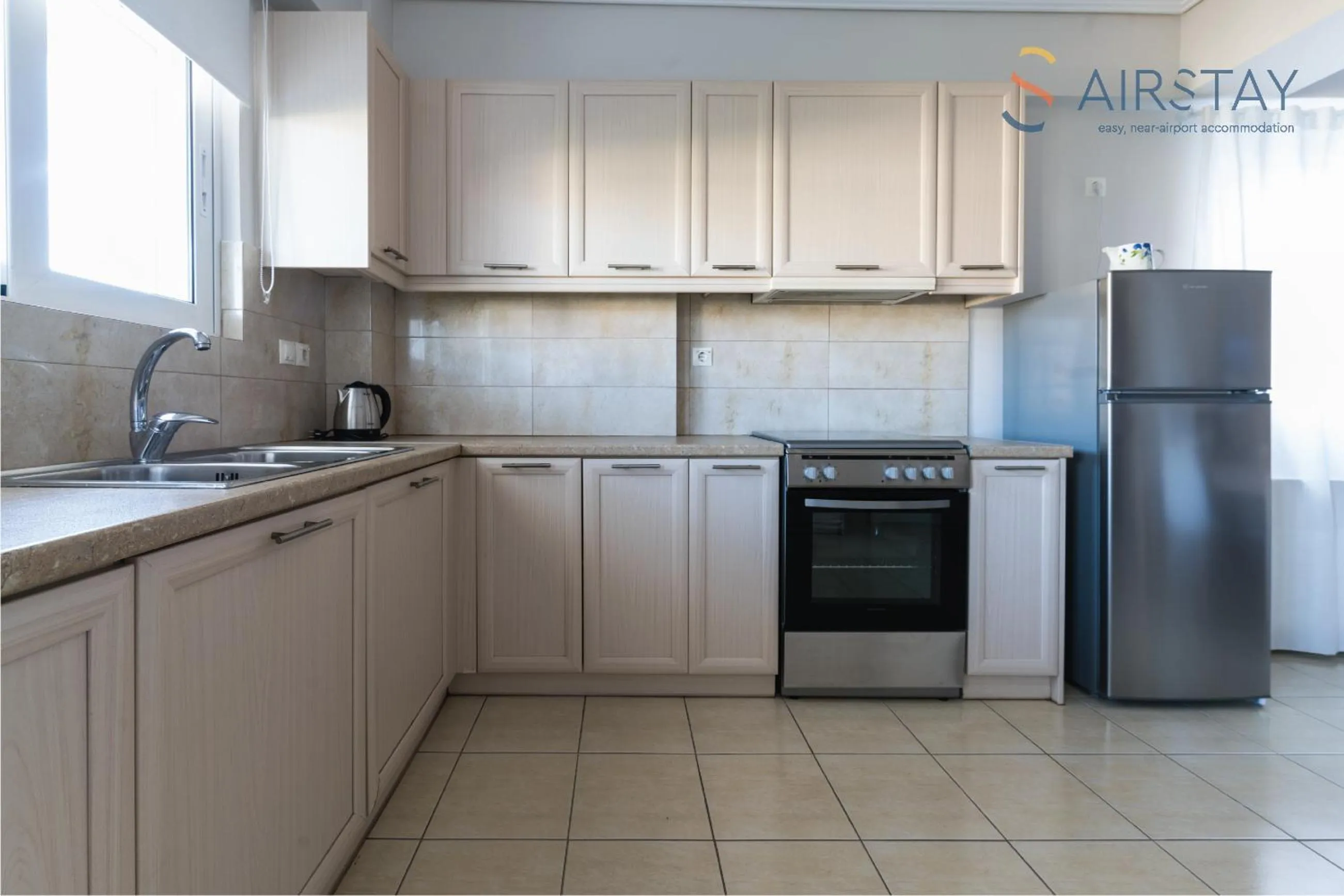 kitchen in Elise Apartment Airport by Airstay