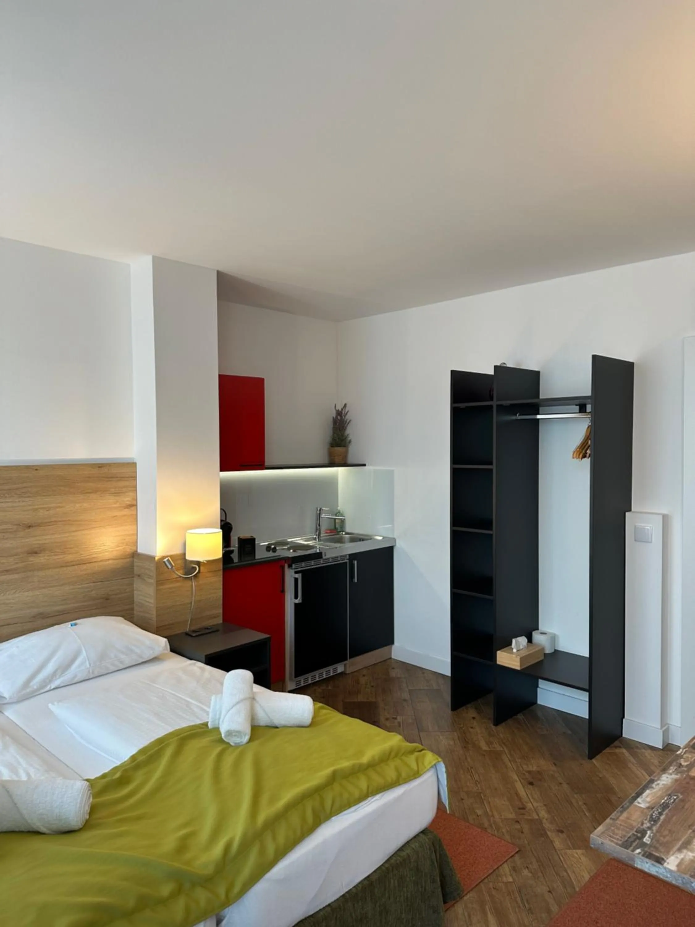 Bed in Versava Apartments