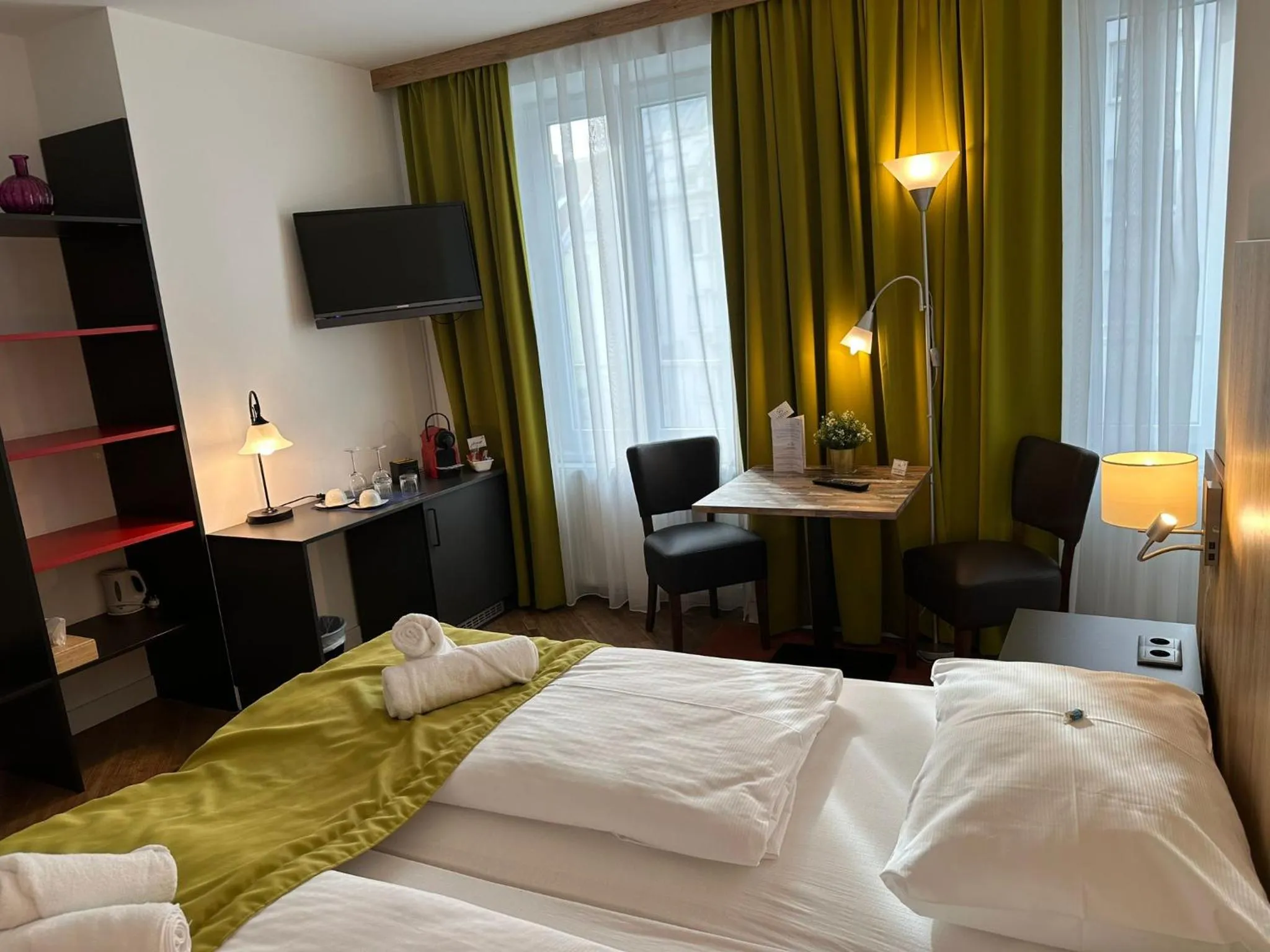 Bed in Versava Apartments