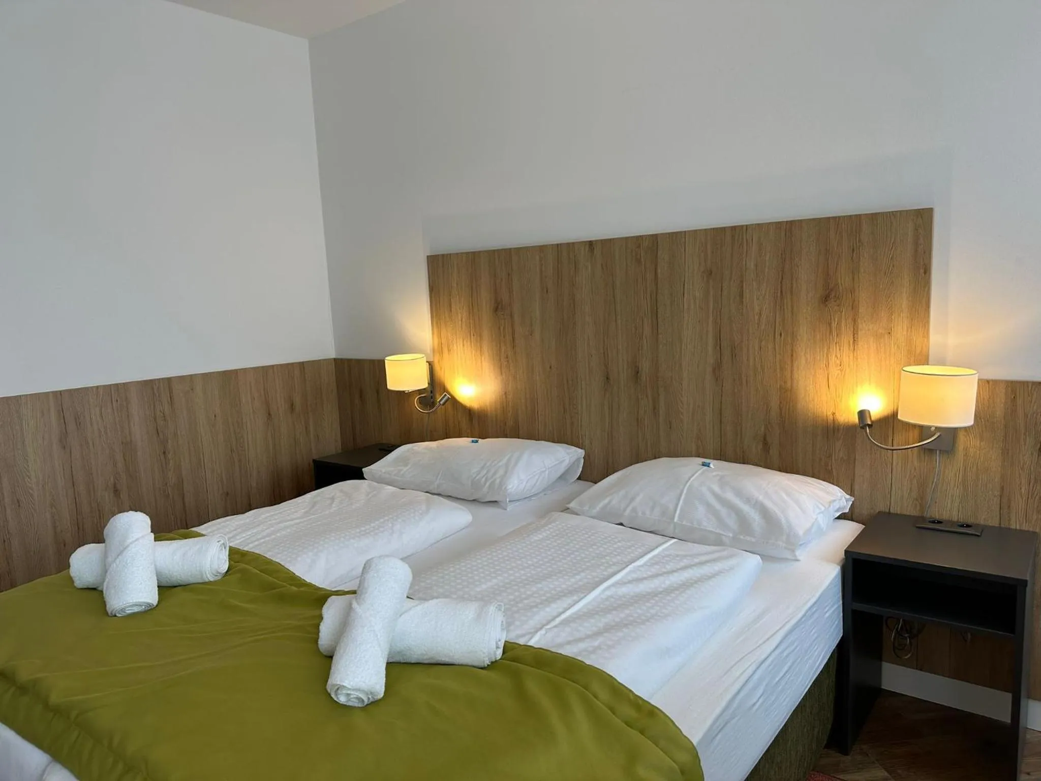 Bed in Versava Apartments