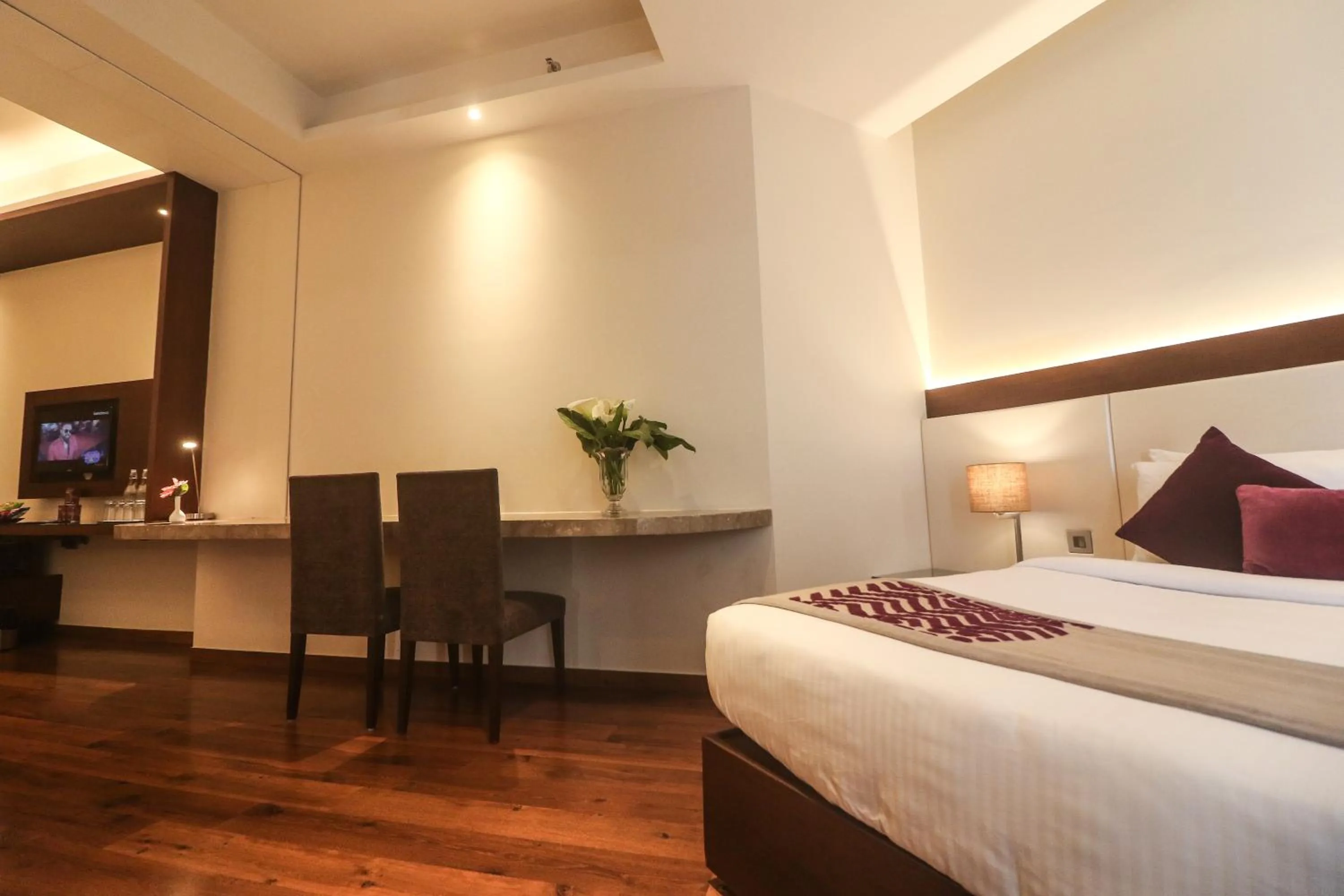 Seating area, Bed in Marigold Sarovar Portico Shimla