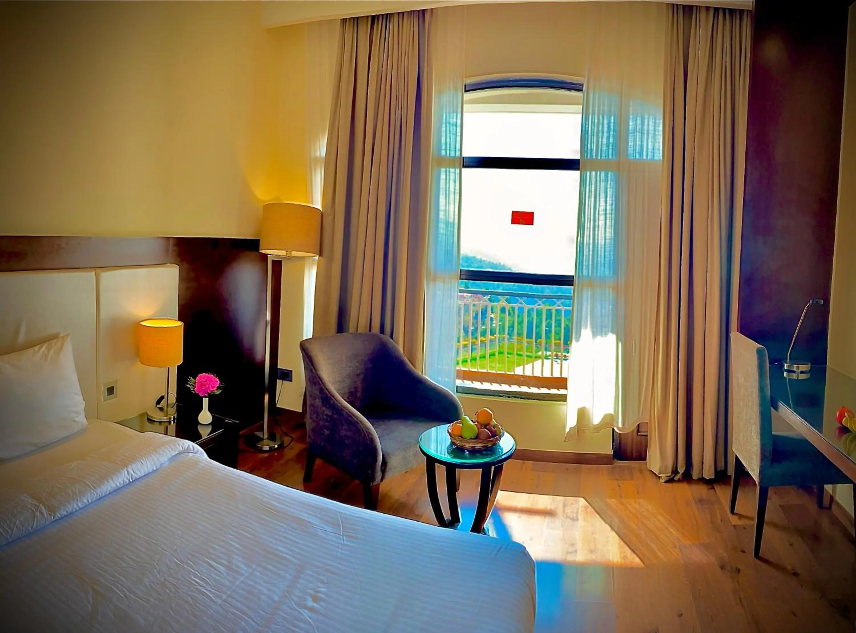 Seating area, Bed in Marigold Sarovar Portico Shimla