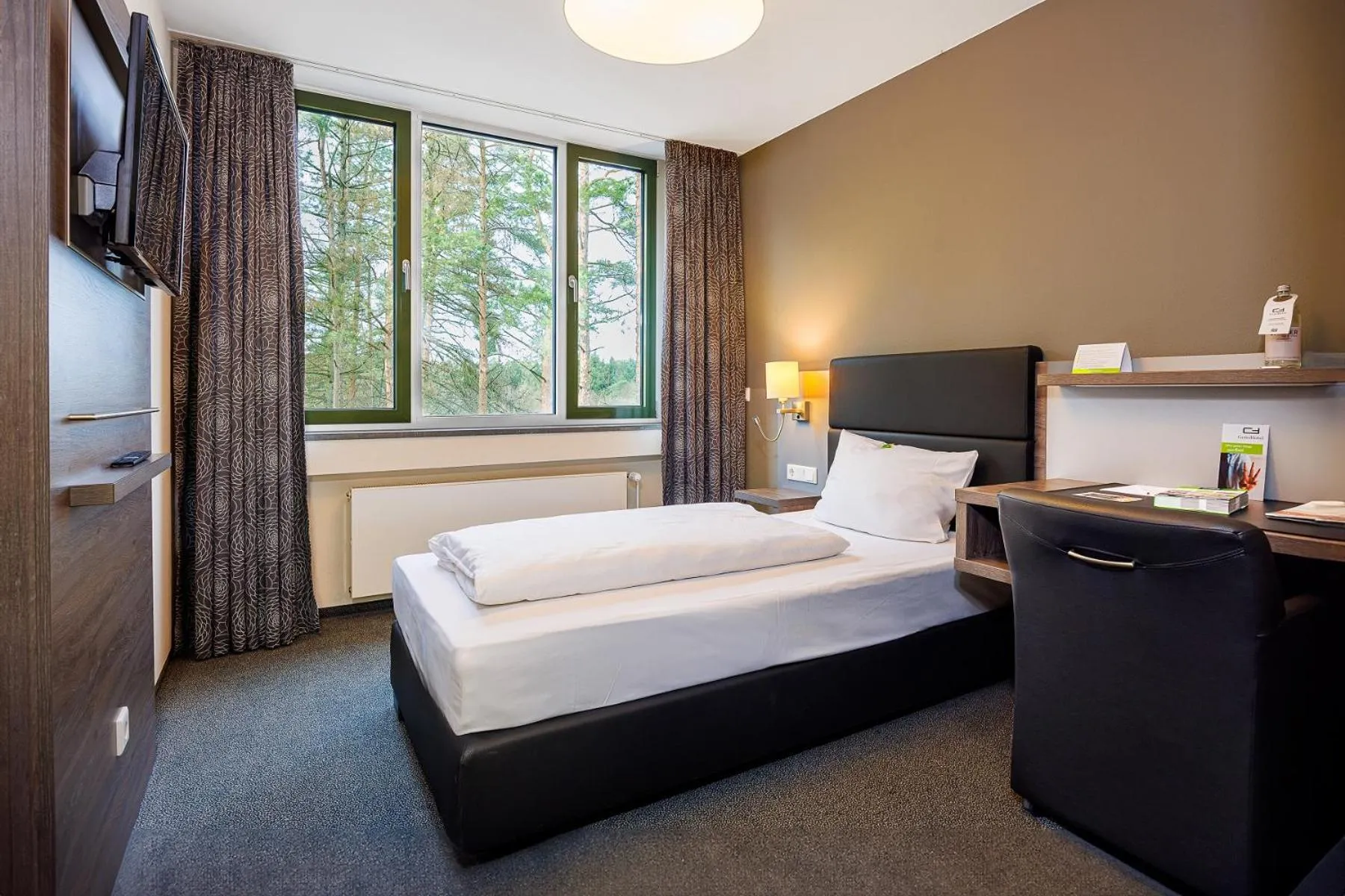 Photo of the whole room, Bed in GenoHotel Forsbach