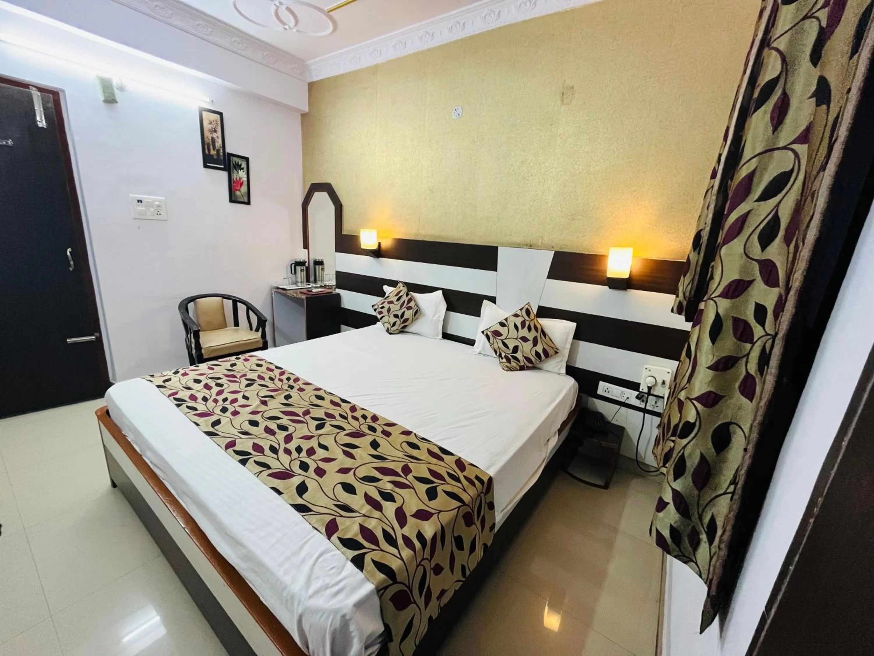 Bed in Hotel Mani International