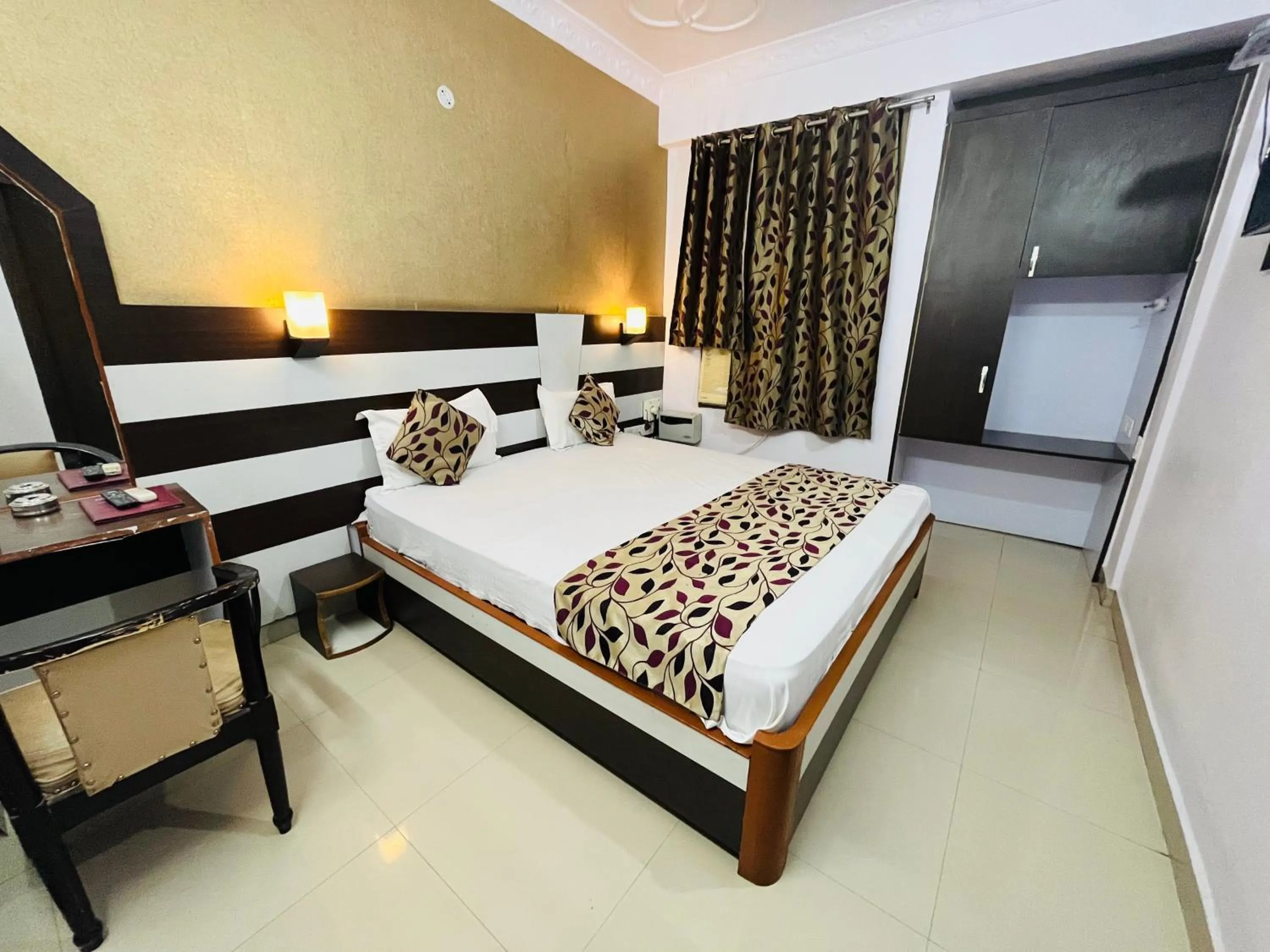 Bed in Hotel Mani International