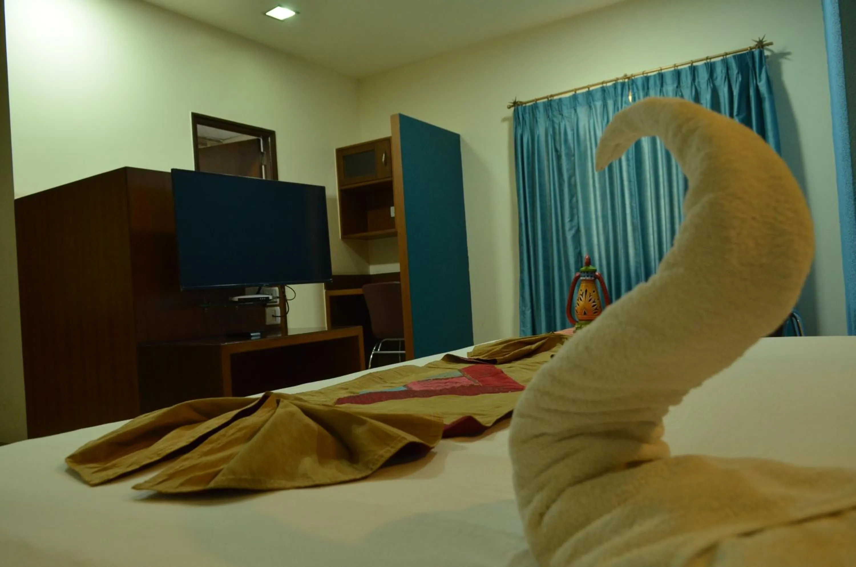 Bed in Cubbon Suites