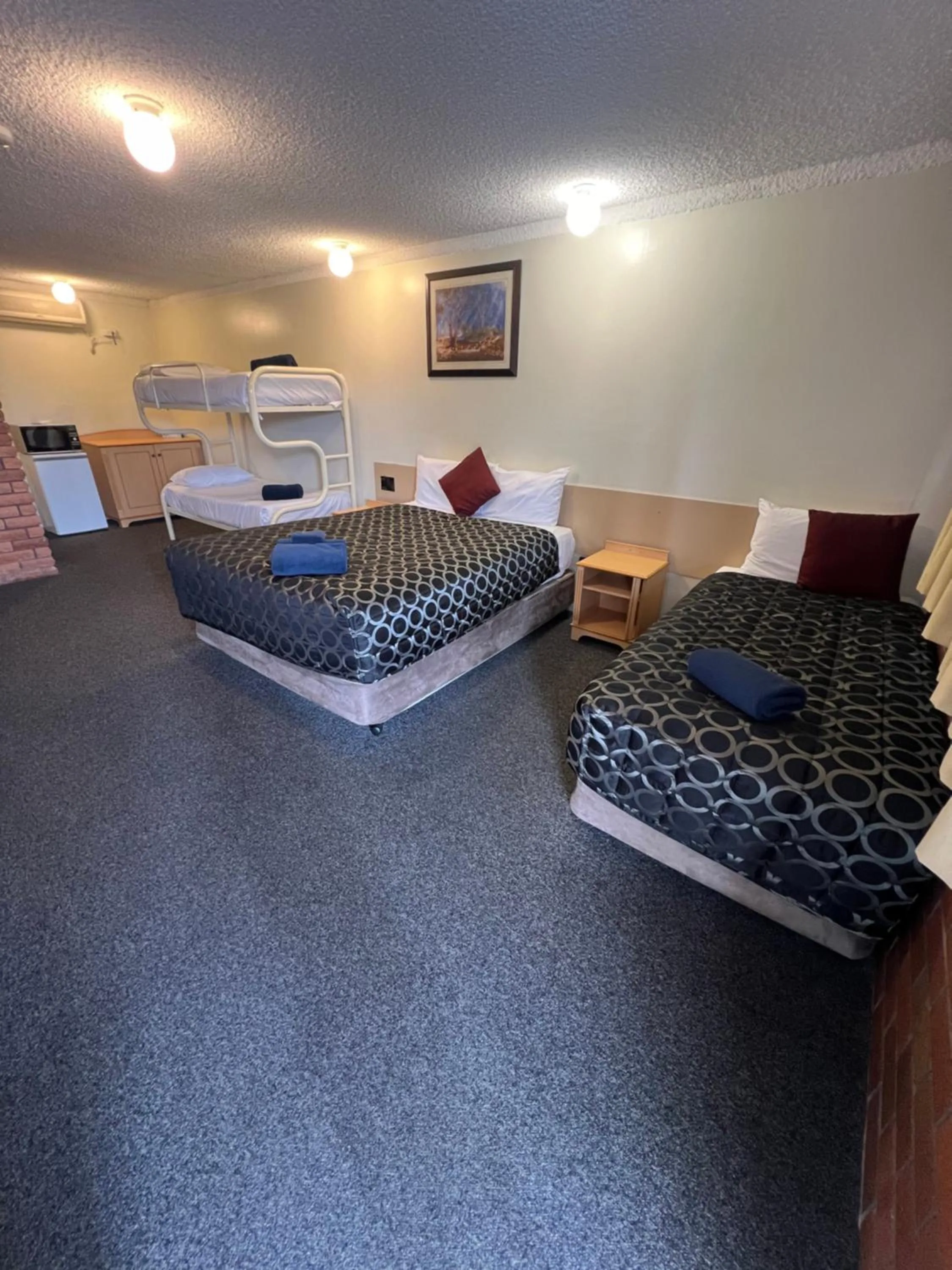 Bed in OVERLANDER MOTOR LODGE