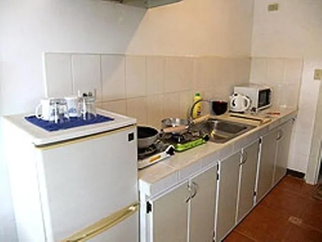 Kitchen or kitchenette in Himawari Hotel