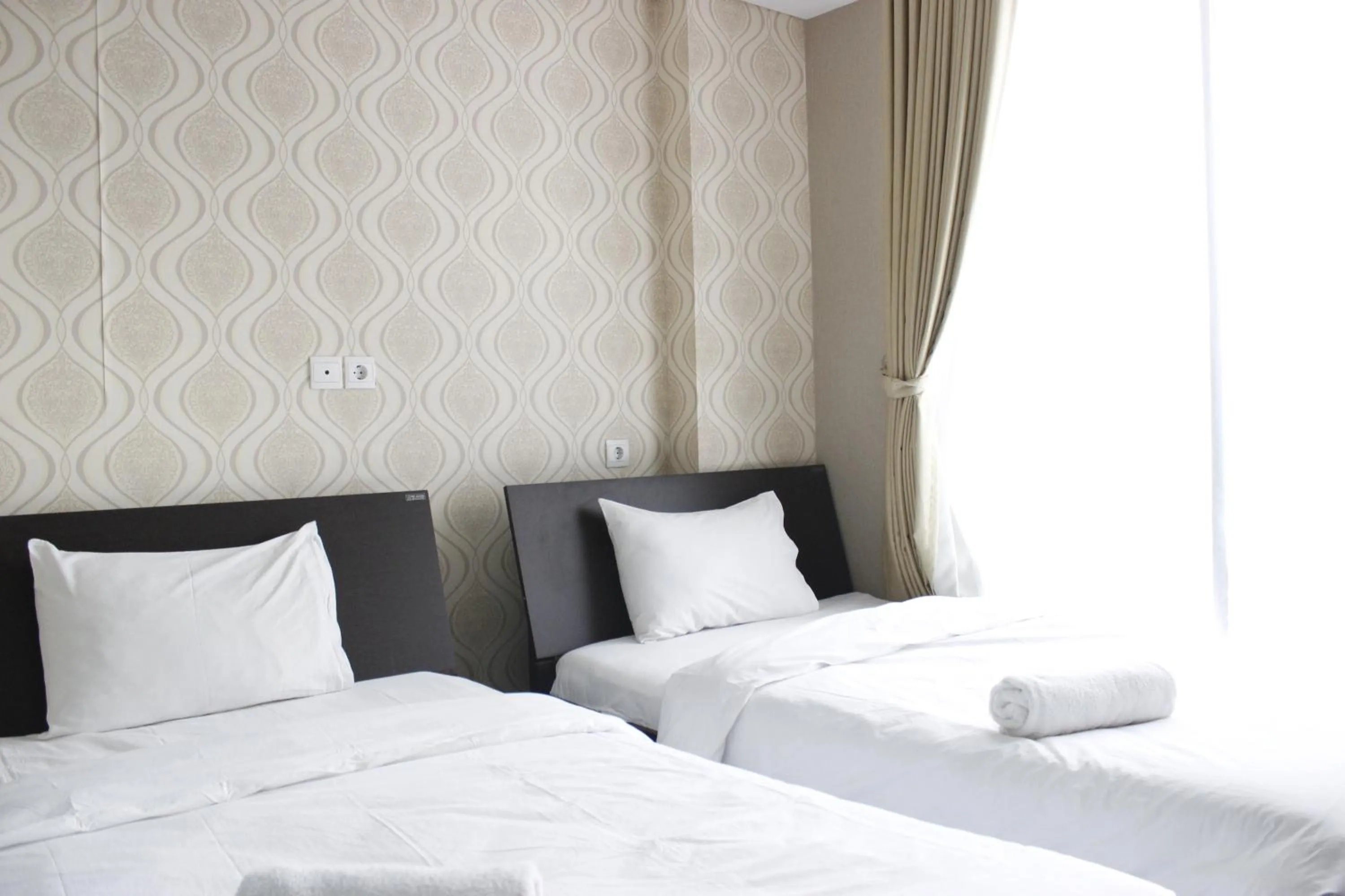 Bed in Stylish 1BR near ITB University at Dago Suites Apartment By Travelio