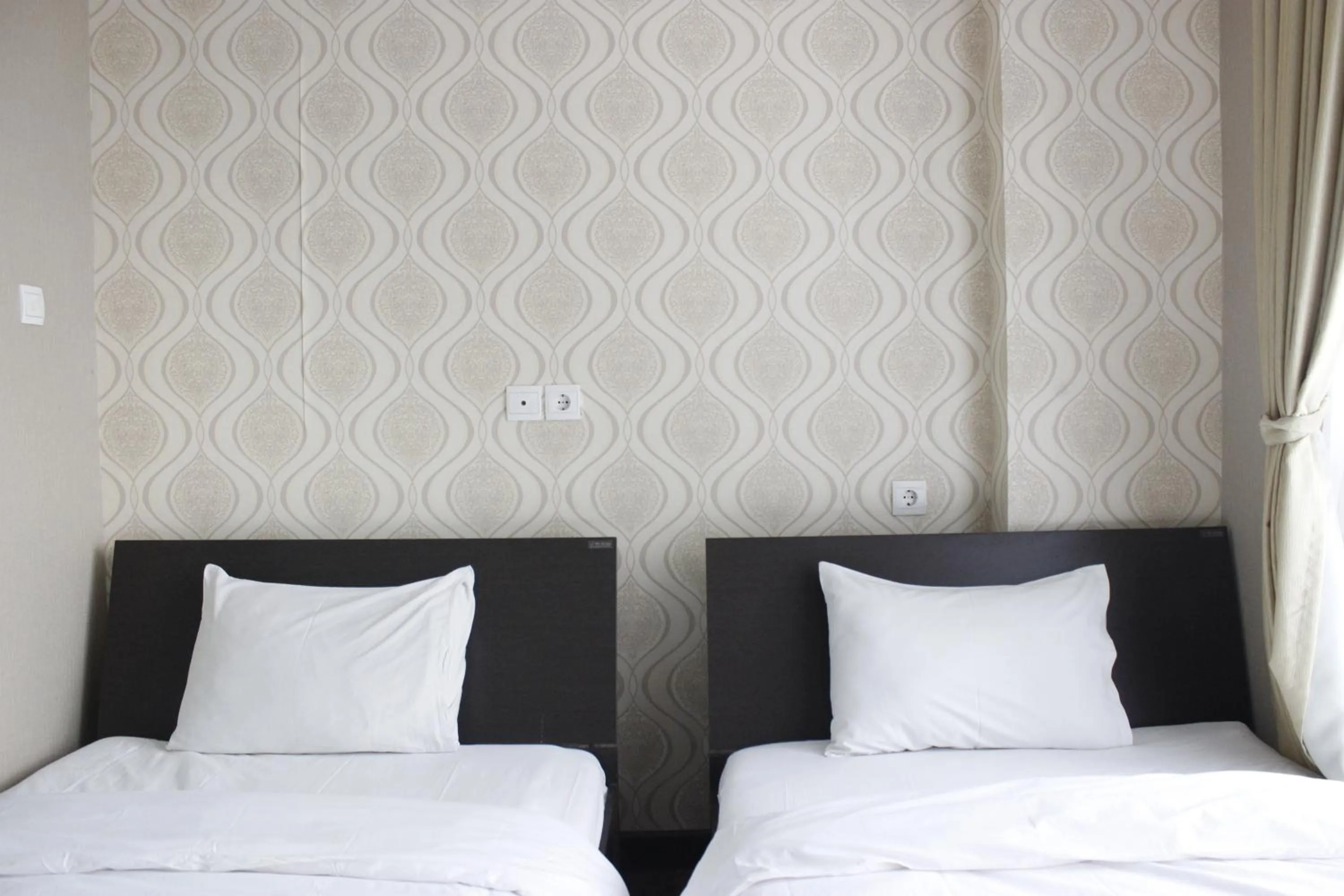 Bed in Stylish 1BR near ITB University at Dago Suites Apartment By Travelio